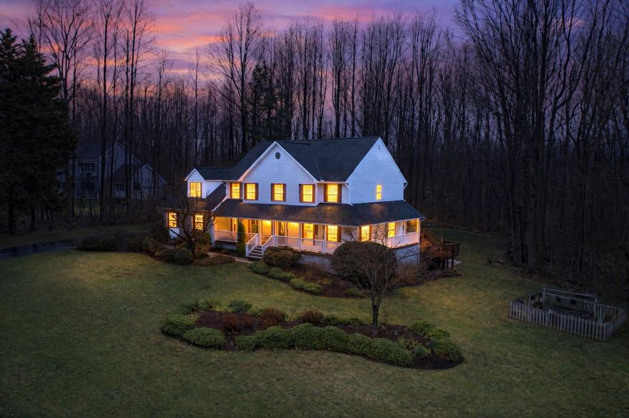 Welcome to the highly sought-after neighborhood of Victoria Station, a beautiful lake community featuring tennis and pickleball courts, a basketball court, playground, walking path, benches, and a lake for morning or evening strolls, as well as catch-and-release fishing. Welcome HOME to Victoria Station’s-1860 Battery Lane, a beautifully landscaped home with a backyard oasis perfect for entertaining and hosting celebrations of all kinds. Enjoy the large custom-built patio, firepit, water features, and landscape lighting throughout, (connected for easy access) wired to a switch.  Step inside the open foyer and be captivated by the new 2025 gourmet kitchen, featuring quartz countertops, stainless steel appliances, a stunning backsplash, and elegant finishes. The oversized island offers ample space for serving, cooking, and entertaining, along with a retractable charging station built right into the quartz countertop. The kitchen also includes a beverage bar with instant-hot and filtered water access, a built-in beverage fridge, a tastefully designed indoor herb garden planters, perfect for growing your own herbs and spices year-round. The main level features a half bath, a custom office space ideal for working from home or homeschooling, a formal sitting room overlooking the wraparound, a dining room with door access to the back deck, and a spacious family room with a glass enclosed gas fireplace and custom built-ins. Upstairs, the primary suite offers a large walk-in closet spacious enough for two featuring automatic lighting as you enter and a touch lighted full length mirror. Three additional generously sized bedrooms and closets, as you continue through this spacious upstairs, and a full hall bathroom provide plenty of room for a growing family. The hall bath was customized to separate the shower area from the vanity, allowing two people to use the space at the same time. UPPER LEVEL LAUNDRY adds everyday convenience. The fully finished basement offers excellent potential for multigenerational living, featuring a living room, playroom/craft room/office, large bedroom, full bathroom, and a kitchenette serving area with access directly to the backyard patio. The basement level entry creates a private entrance opportunity to access the lower level without going through the main entrance of the home. Situated in a cul-de-sac on 1.02 acres backing to mature trees, the property also includes a beautiful fenced garden, established and ready for your homegrown vegetables and more. A 2-car garage and ample driveway parking provides plenty of room for multiple vehicles, as well as space for a trailer or boat. More upgrades to include Lawn Sprinkler System and customized to water the gardens, Gas Water Heater was replaced in 2024/25, Windows by Thompson Creek 2011, HVAC 2010, Radon Mitigation 2021, Roof 2011, Gutters & Guards 2011, Bright custom lighting throughout this home including lighting in all bedroom and foyer closets. The yard is surrounded by a Dog-Watch buried Hidden Fence (dog collar included) allowing pets free run of the property. (25.1 miles) to Joint Base Andrews, (41.4 miles) to Pax River Naval Station, (30.1 miles) to Naval Academy Annapolis, MD, (40.6 miles) to Fort Meade Main Gate, (35.7) miles to Pentagon. Located just minutes from North Beach, Chesapeake Beach, Herrington Harbour North & South, North Beach Boardwalk, and a variety of restaurants, shopping, parks and recreation. Welcome to Calvert County and all it has to offer!