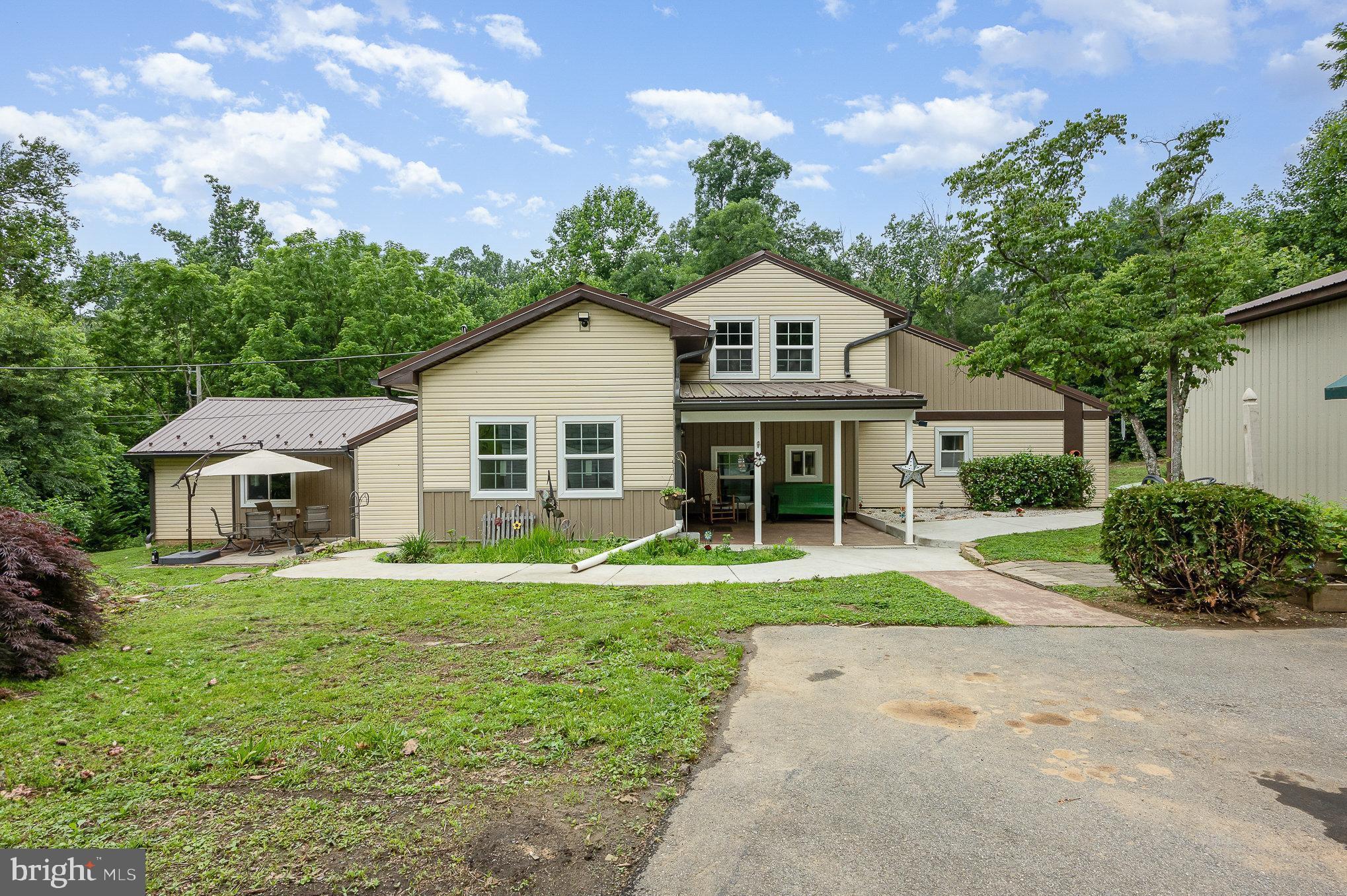 Coming this Saturday, a nicely updated & secluded 4 Bedroom Ranch with a 2nd Floor Accessory Unit. The Property is conveniently located too almost everything & offers Privacy & space to relax on over 2.3 acres & adjacent to the North East Creek. The Home provides over 2,130 sf of Living Space with a huge Kitchen & Primary Bedroom with custom stone & wood Walls. Outside you will enjoy relaxing & hearing the rolling Creek on 1 of your 3 Patios or Porch. If Hobbies are your thing there is a 28’ x 32’ Detached Garage with Car Lift. The House has many recent updates & some include a new metal Roof, Gutters, vinyl Siding, most Windows, Sideways & the Interior Doors. The 2nd Floor Accessory Unit with separate Entrance offers even more potential. Don’t miss this great Opportunity. Schedule your Personal Showing today.