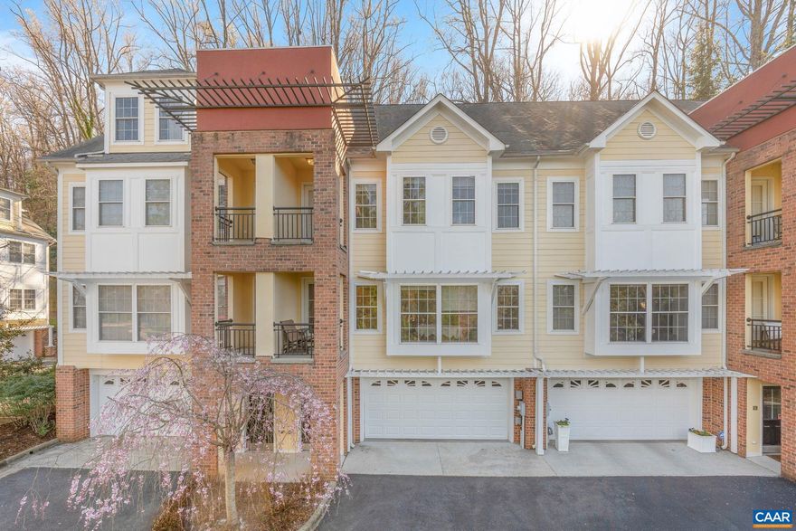PRICE REDUCED! Sophisticated and elegantly maintained and upgraded Poplar Glen townhome with elevator and Blue Ridge Mountain views! Smart low maintenance living all within walking distance of UVA Grounds, JPJ sports complexes & Scott Stadium, dining, shopping and more! The bright and open floor plan features upscale finishes, hardwood flooring, 9' ceilings, tasteful ceiling molding, recessed lighting, remodeled tile bathrooms with Krugg LED mirrors, built in sound, central vacuum, 2 sided gas fireplace, 2nd and 3rd level balconies, wonderful rear brick courtyard and large garage. Fully featured kitchen with leathered granite counter, newer stainless wall ovens and fridge. Primary bedroom with walk in closet with built-ins and stunning tiled bath with dual sink vanity and heated floor/towel rack. Additional bedrooms with built-in closets and shelving. Stunning 3rd level tiled hall bath and laundry room. And all accessible by the elevator! Attic installed air purifier. Ground floor combination room perfect for home theatre or workout room. Plenty of main level storage and a large 2 car garage. And all in a supremely convenient yet quiet neighborhood that is just minutes from downtown Charlottesville, Farmington, Boars Head and UVA!,Granite Counter,Wood Cabinets,Fireplace in Dining Room,Fireplace in Family Room