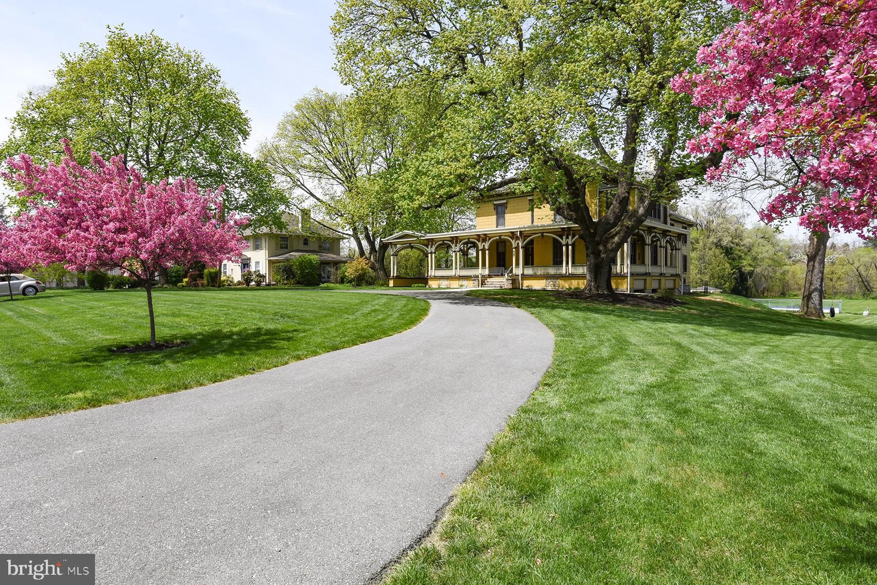 Truly one of a kind. Known as "Oak Hill" this Italianate Villa has been restored to all its grandeur. The property is currently operating as a successful Vacation Rental property. It is managed by the Evolve hospitality company and is advertised on vacation marketplace sites such as AirBNB, VRBO and Marriott Fine Homes. This can be halted at anytime, contact listing agent for additional info. This mansion boasts 6 bedrooms, 5 and a half bathrooms, 3.15 +/- acres, over 9,700 +/- total square feet including basement, 11 foot ceilings, ornate moldings, inlaid hardwood floors, 5 fireplaces, large functioning pocket doors, multiple covered porches and deck. The majority of the furnishings will remain. A more detailed list is available but in general it includes most of the antique furnishings shown in the pictures. Construction began prior to the Civil War and was completed afterward. The first family to occupy Oak Hill was the Honorable William Stenger in 1875. Mr. Stenger served as the District Attorney of Franklin County. The current owners, who purchased the home in 1995 have meticulously restored and added to the home with no expense spared. First floor living room, billiard room, parlor, sunroom, grand formal dining room with custom made chandelier from Prague and fireplace, doors wrapped in fine Italian leather lead into the butler's pantry and mudroom. Monticello style window leads you from the living room to the covered wraparound porch. Part of the modern two-story addition, the kitchen includes; a Sub-Zero refrigerator, Wolf gas range, professional grade hood, two Bosch dishwashers, built-in Sub-Zero icemaker, Sub-Zero wine cooler, built-in Sub-Zero food warmer, granite countertops, custom cabinetry, heated hardwood floors, dining area with fireplace, walk out to covered porch and deck. The mezzanine area consists of heated floors, sitting area, second floor porch, full bath with washer and dryer, a bedroom currently used as a media room with a fireplace and full bathroom. Continuing to the second floor you'll find a large center hall, 4 bedrooms, 2 full bathrooms, a sleeping porch that's accessed from a bedroom via a Monticello style window. The primary suite consists of a walk-in closet and access to a Jack and Jill bathroom. 2 separate walk-up floored attics, the main attic has a widow's walk. The full basement includes a spacious workshop, fitness room, game room, utility room, a 19th century brick wine cellar, multiple large unfinished rooms great for storage. Basement is walkout level to backyard. Inground pool with pool house. Expansive backyard backs to trees. 2 car attached garage, carriage porte-cochère, circular driveway. Extensive landscaping. Adjacent to Wilson College. Minutes to I-81. Convenient to schools, shopping, grocery, etc. An information package is available, including details of the extensive renovations and history.