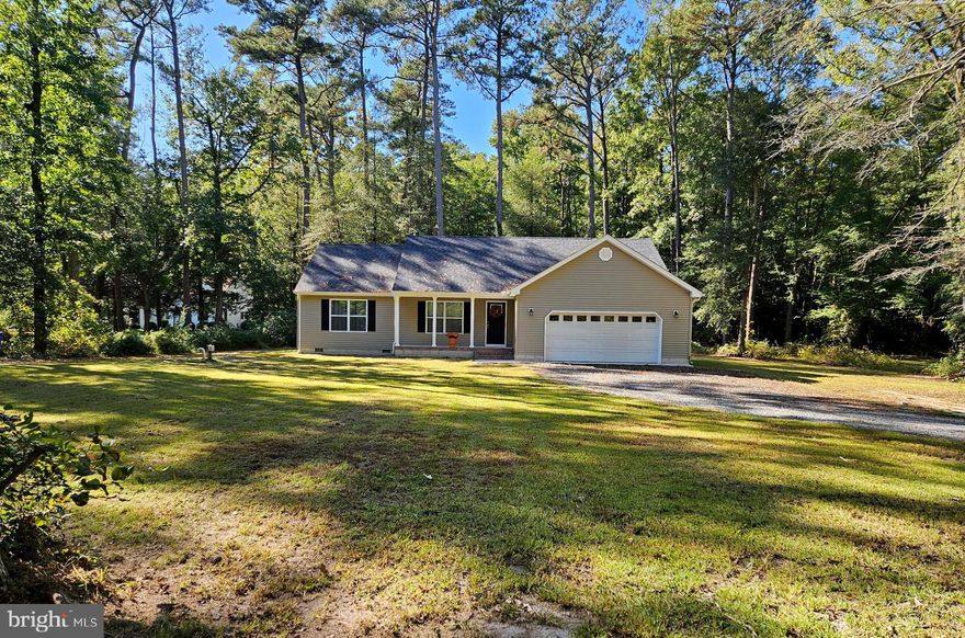 Wow this almost new 1503 sq. ft. home  with an attached two car garage on a .80+/- acre lot. All on one level, The open-concept center of the home features a  kitchen, dining area, and living room, ideal for both everyday living and entertaining. The cheery kitchen features white cabinetry, stainless steel appliances, granite countertops, and a window over the sink overlooking the backyard. Sliding doors from the dining area provide easy access to the rear yard. Luxury vinyl plank flooring flows throughout the main living area. There is a separate laundry room next to the entry to the two-car garage. The split floor plan has the primary suite  with a large walk-in closet and en-suite bath on one side of the home and the two additional bedrooms and second bath on the opposite side. The backyard has a tree lined area across from the patio making this perfect for your outdoor gatherings.