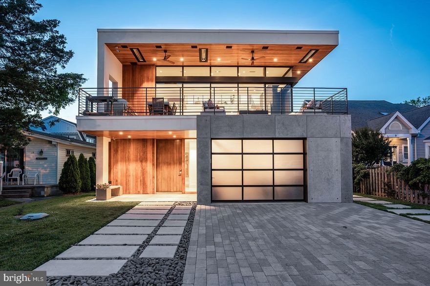 Welcome to 15 Cullen Street, a modern masterpiece located in the ocean block of the highly desired neighborhood known as Rehoboth by the Sea. Renowned architect, Randall Mars, carefully blended the ideal coastal setting with flawless design and sophistication. Situated only steps from the ocean, this stunning residence features a total of 5,500+/- square feet including 5 bedrooms, 6.5 bathrooms and casually elegant living spaces on each of the home’s three levels. Upon entry, clean lines, tasteful décor make a dramatic impression. The first level features 4 spacious bedrooms with luxurious spa-like baths, a spacious living area complete with wet bar with quartz counters and refrigeration. In addition, a mudroom with direct access to the outdoor shower and a 1-car garage, perfect for bikes and storage. Rich walnut stairs guide you to the main level (2nd) where you will find a spectacular great room complete with polished concrete floors, soaring ceilings and a sleek fireplace with marble surround. The interior space is fluidly connected to the environment by floor to ceiling glass that completely opens to the expansive terrace with seating area, built-in fire pit, dining area and outdoor kitchen with gas grill and beverage center. The custom kitchen features stunning white cabinetry, stainless steel appliances and a window stretching the length of counter. The island is emphasized with gorgeous quartz counters with a waterfall edge and range hood artfully built-in a walnut accent piece. The space is finished with a dining area, wine storage and beverage center. In addition, this level includes the primary suite complete with a custom walk-in closet and a luxurious and sleek private en-suite bath. Perched on the third level is a superior flex space currently being utilized as an executive office. This generously sized room includes a full bath, private balcony and direct access to the sundeck boasting superb ocean views. The home is visually striking, and the systems are equally as impressive. With top-notch security and surveillance, audio/video, and smart home technology throughout, you can manage everything remotely from a mobile device. This home includes many features that could not duplicated under today’s building code, and it is truly a one-of-a-kind opportunity. All situated in a sought-after location offering one of the most gorgeous beaches along the Delaware coast. This home truly leaves little to the imagination!