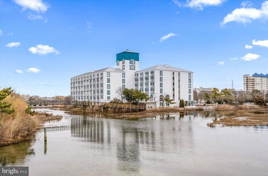 THE BEST BUY IN TOWN WITH DIRECT BAY VIEWS! UNIT IS TURN KEY! 2025 RENTALS MUST BE HONORED; OVER 25K IN RENTALS ALREADY ON THE BOOKS!  SELLER HAS PAID THE SPECIAL ASSESSMENT!  Welcome To Your Ideal Ocean City Getaway At Coconut Malorie, Where Over A Million Dollars In Recent Building Renovations Make This Property A Fantastic Investment And An Incredible Place To Unwind. NOTE MONTHLY DUES INCLUDES ALL UTILITIES! WATER, SEWER, HEAT, CENTRAL AIR, TRASH, PARKING, HAZARD INSURANCE AND ALL CONDO AMENITIES! Located In A Prime Midtown Location, This 1-bedroom, 1-Bath Condo Offers The Perfect Blend Of Convenience And Luxury, Just A Short Distance Away From The Sand And Surf.
Enjoy Breathtaking Nightly Sunsets And Panoramic Views Without The Million-Dollar Price Tag! This All-Tile Unit Features A Convenient Kitchenette, Making It Ideal For Both Personal Use And Potential Rental Income. Current Owners Produce A $30K Income Per Year Renting Via VRBO & Air BNB.  With One Simple Monthly Fee, You Can Leave The Worries Of Utility Bills Behind. Exceptional Community Amenities That Include Game Room, Billiards, Library, Outdoor Pool, Fitness Area & Cable! Easy To Show/PRICED TO SELL!