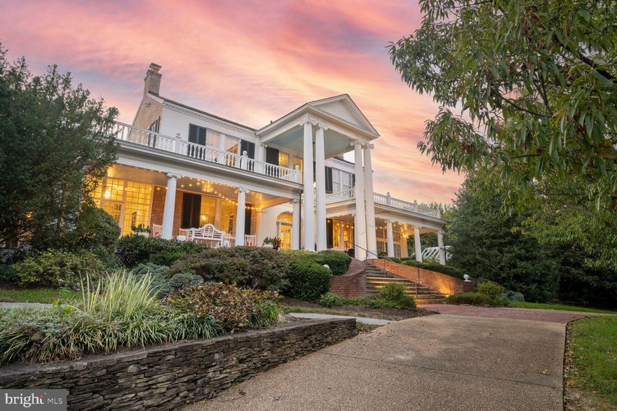 Welcome to  Mt. Ida, an exquisite single-family home in the heart of Alexandria, VA. This historic home was built in 1808 by Charles Alexander, Jr. - a sixth generation from John Alexander, after whom Alexandria was named. Spanning over 6,000 square feet, this detached residence offers an unparalleled blend of luxury and comfort. With five spacious bedrooms and four full and three half baths, this home is designed to accommodate both intimate family living and grand entertaining.

Step inside to discover architectural elegance featuring built-ins, columns, crown and decorative moldings, and exposed brick. The high ceilings and eastern exposure flood the home with natural light, accentuated by floor-to-ceiling and oversized windows with tasteful treatments. The ambiance is further enhanced by chandeliers and recessed lighting throughout.

The chef's kitchen is a culinary dream, boasting a breakfast bar, marble counters, and premium stainless steel appliances, including a gas stove and side-by-side refrigerator. The open kitchen design flows seamlessly into an eat-in area and formal dining room.

Relax in the expansive living spaces, with six working fireplaces, a library/den, a music room, and a home office. The primary suite is a sanctuary featuring a walk-in closet, exercise area, ensuite with separate shower and soaking tub, and windowed bathroom.

Outdoor living is equally impressive, with a private roof deck, back and front yards, patio, and porch. Enjoy panoramic river and garden views from every angle. Additional amenities include a basement, an attached two-car garage, a circular driveway with ample parking, and a security system,

Experience luxury living at its finest in this Alexandria gem.