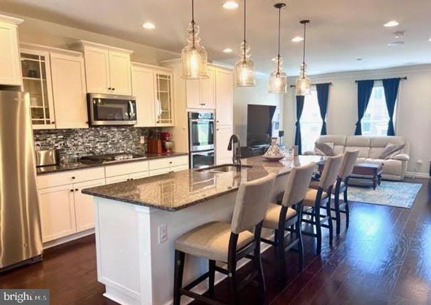 Stunning Townhome for Rent in Belmont Run – Backs to Serene Woods!

Discover this beautifully upgraded townhome in the highly desirable Belmont Run community of Broadlands. With over 2,300 sq. ft. of thoughtfully designed living space, this elegant home features three spacious bedrooms, each with a walk-in closet, 3.5 baths, and a two-car garage with additional storage solutions.

Modern & Open-Concept Living:
The Haddington model offers an open floor plan with 9-foot ceilings on every level and rich mahogany hardwood floors throughout the main level. The chef’s dream kitchen boasts an 11-foot center island, double ovens, ample cabinetry, and stainless-steel appliances. The living and dining areas open to a private deck overlooking peaceful woods, creating an ideal space for relaxing or entertaining. The living room is pre-wired with four in-ceiling speakers, supporting up to a 9.2 Dolby surround sound setup.

Luxurious Owner’s Suite & Spacious Bedrooms:
Upstairs, the owner’s suite is a true retreat, featuring two walk-in closets and a spa-like en-suite bath with a soaking tub, separate shower, and dual vanities. The additional bedrooms include custom cordless “up-down” blackout blinds and elegant curtains for added privacy and comfort.

Versatile Lower Level:
The fully finished lower level provides a flexible living space with a full bath and six in-ceiling speakers, supporting up to an 11.2 Dolby surround sound setup—perfect for movie lovers and audiophiles.

Smart Home Features & Premium Upgrades:
This high-tech smart home is equipped with:

✔ Wi-Fi-enabled 50-Amp Level 2 EV charger
✔ Alexa-compatible smart switches throughout
✔ Dual-zone HVAC with fresh air intake & Ecobee smart thermostats
✔ Backup generator hookup for uninterrupted power
✔ Whole-house ACB water filtration system

The garage includes two 4x8 ceiling-mounted storage racks (supporting up to 600 lbs. each) plus an extra 180 sq. ft. of storage in the HVAC room.

Unbeatable Location!
Located just 2 miles from Ashburn Metro, with easy access to the Dulles Greenway and only 10 minutes to Dulles International Airport. Zoned for the highly rated Briar Woods High School and steps away from Brambleton Park, golf courses, movie theaters, shops, and dining.

Lawn service included with HOA!

This is a rare rental opportunity—schedule your tour today!