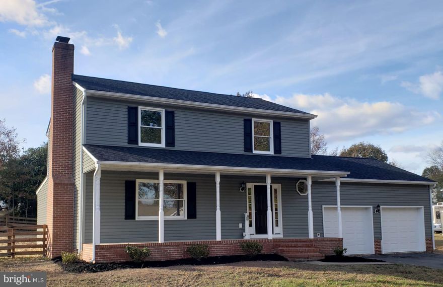 Don't miss this newly remodeled home in Stonewall Estates.  Cozy, warm  and inviting this home is  a must see.  Main floor has a large living area with beautiful vinyl plank flooring and a fireplace (w/ a pellet stove insert that can be removed and converted back to a wood burning fireplace). House  has a brand  new kitchen with granite counters, white shaker cabinets and all new factory warrantied appliances.  Family room is perfect for entertaining and the wonderful, large sun room  is perfect for relaxing.  Laundry room is on the main floor.  Upstairs you will find a  comfortable master suite with a brand new bathroom.  Bedroom two and three (also on the second floor) share a bathroom.  Large fully fenced yard on a corner lot.   Luxury vinyl plank flooring, carpet  and tile throughout the entire home.