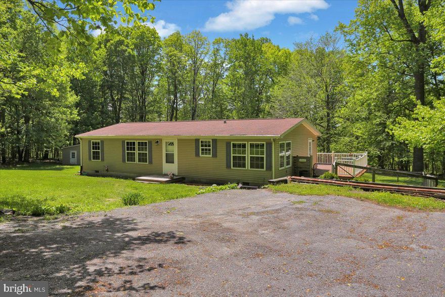 Tucked away on  a private road in the Honey Brook area of Chester County, this beautifully maintained 3-bedroom, 2-bath ranch home offers the peace and privacy you've been looking for. Set on 1.2 acres, this property delivers true one-floor living surrounded by quiet, natural serenity.

Step inside to a spacious, bright and cheery living room filled with natural light, perfect for relaxing or entertaining. The eat-in kitchen comes fully equipped with all appliances included, offering both convenience and functionality. The primary suite features an en suite bath with a soaking tub, separate shower, and double vanity - your own personal oasis at the end of a long day. 

Enjoy outdoor living on your large rear deck overlooking a fenced in pet play area and woods beyond, creating a tranquil setting with plenty of room to  unwind. The 24' x 32' detached garage is a standout feature for any craftsman or hobbyist, complete with a workbench, upgraded electric, and abundant storage. 

Additional highlights include low taxes, central A/C, propane gas for heating, hot water, and cooking plus a Generac generator for peace of mind. 

Fee simple ownership means no park approval, no lot rent, and no HOA restrictions - just quiet, private living without compromise. Move-in ready and meticulously cared for, this home is a rare opportunity to enjoy serene country living at its best! 

Call today for more details and to schedule your exclusive showing.