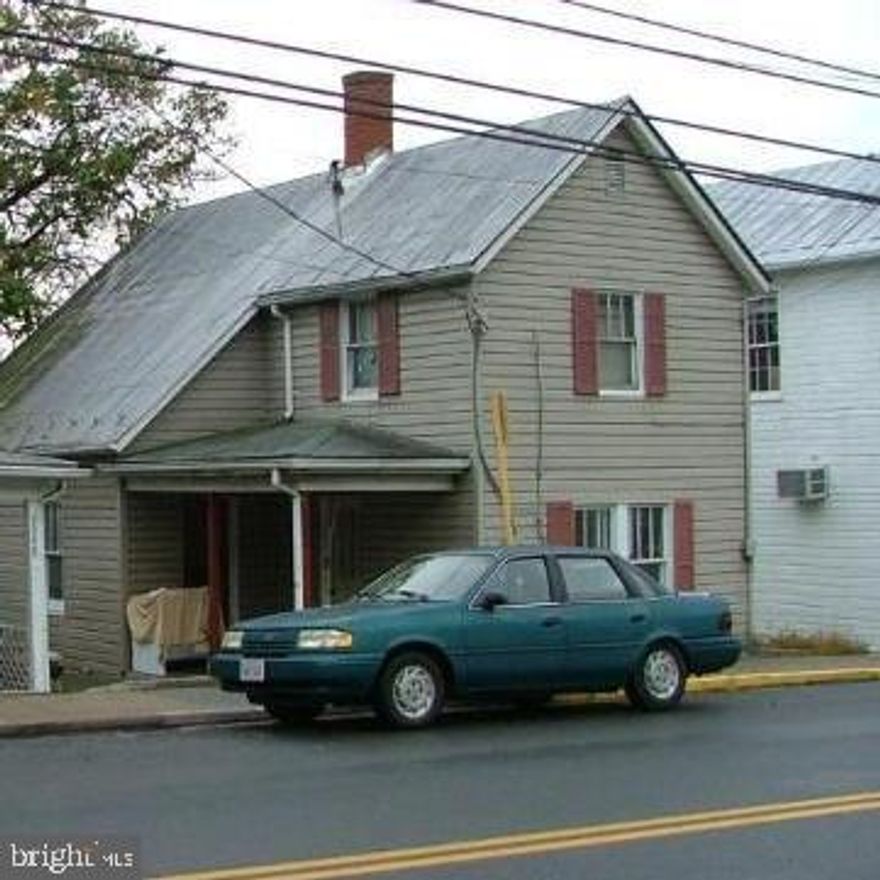 Older two story house with four bedrooms and one bath.  There is another bathroom upstairs but not functioning at this time.  PROPERTY SOLD "AS IS" AND INSPECTIONS ARE FOR INFORMATION PURPOSES ONLY.  Tenant is on a month to month lease.  This house can be made back into two units.