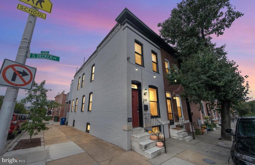 This Canton rowhouse offers everything you need for the perfect city life! The features you want are all here, starting with your own private, off-street parking spot—a true game-changer in city living. As a sought-after end-of-group rowhouse, this home enjoys an exceptionally bright and airy atmosphere throughout its three finished levels.

This turnkey property underwent a full renovation in 2021, ensuring modern style and function. Location is unbeatable: you are just one block from Patterson Park and have an incredible walkability score to all the renowned restaurants, bars, and entertainment of Canton, including the waterfront park and Boston Street shopping.

Inside, you'll find elegant hardwood floors throughout. The gourmet kitchen is designed for the modern chef, featuring 42" cabinetry, granite countertops, stainless steel appliances, and contemporary under-cabinet lighting.

The intelligently designed layout includes three bedrooms and three full bathrooms. The upper level hosts a convenient bedroom-level washer and dryer and a  luxurious owner's suite with a beautiful, spacious primary bathroom. The fully finished basement is highly versatile, providing essential storage, a third full bathroom, and a flexible space perfect as an office, den, or guest room. Enjoy multiple options for private outdoor space, including a charming rear fenced-in patio and your private rooftop deck for entertaining or relaxing with views!

The basement sump pump and waterproof system will provide additional confidence and worry-free living.

Perhaps the most exciting feature is the financial advantage: this property benefits from approximately 5 years of the valuable CHAPS TAX CREDIT remaining, current annual property taxes are only $3,412.