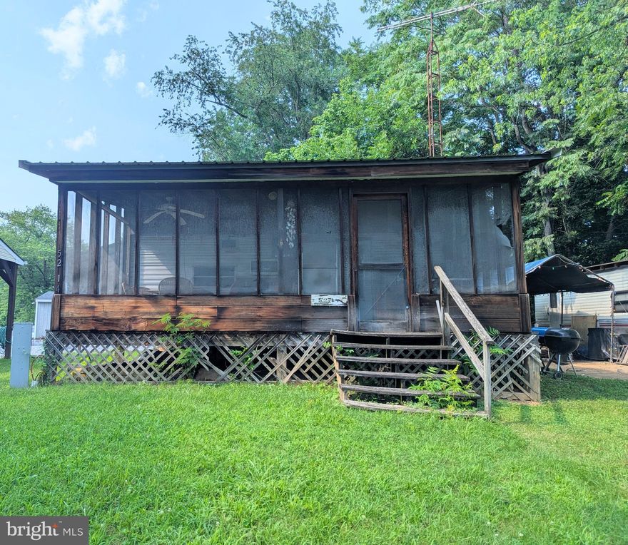 Great lot with so much potential to put your own design on the property.  Property needs work done to be able to use the lot but great bones to start.  This lot has sewer hookup, so no pump outs to worry about.  Screened in porch in the front and room for parking.  

This is a gated community, so you need to enter at the guard shack. Entry is not permitted without ID per the office rules. Bring IDs to the office or guard shack for visitor pass. THIS IS A SEASONAL CAMPGROUND! OPEN FROM APRIL 1 TO NOVEMBER 1. ** WELCOME TO RIVER BEND/SEASONAL LOT AVAILABLE TURNKEY** River Bend is a privately owned 400 acres recreational- vehicle camp resort with seasonal activities for members, families and guests. This great RV park is tucked away on the Upper Potomac River of West Virginia; River Bend is one of West Virginia's most popular family seasonal destinations.  Just a short drive from the Washington and Baltimore metro area. Open with utilities from April 1 to November 1. Lot owners have access to their property the entire year. *** Members Enjoy *** * Amazing views and wildlife, Potomac River access, Trails, Swimming pools, Mini-Golf, Youth center, Tennis and basketball courts, laundry facilities, convenience store, deli and lounge. *Bath houses throughout the park, boat ramp, bar and grill and even a church located on the grounds. River Bend also hosts numerous activities such as 4th of July fireworks, small carnival, bonfires, poker runs, horseshoe tournaments, car show, Halloween Trick or Treat and so much more.