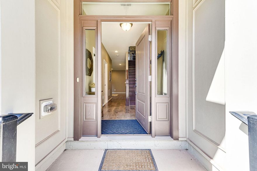 Welcome to this amazing end unit townhome in the highly sought-after One Loudoun. Nestled into the best enclave of the area, this light-filled end-unit is full of custom treats. The entry level boasts a bedroom and full bath, as well as a great flex space that can be used as a game room, play room, or extra living space. The generous garage offers space for parking AND storage. In addition, this gem is the only end unit in the area that backs to greenspace and has a private side yard for the whole family to enjoy!! The main level dazzles even more. The open concept space with hardwood floors offers an amazing chefs kitchen with granite countertops, gas stove, upgraded appliances, and a huge island. The living space is bolstered by the custom, hand-stacked stone fireplace and Shenendoah Barnwood mantle. The large outdoor patio offers plenty of space for entertaining and grilling, and reveals the view of the greenspace, a unique trait in this community! And the sunset views just set it over the top!!!The dining area provides plenty of space to entertain family and friends. The bedroom level hosts the Primary Bedroom with dual walk in closets, en-suite bath with all the bells and whistles, and the two twin bedrooms and another full bathroom. Having the washer and dryer on the bedroom level offers the convenience you'd expect!!  In close proximity to all of the amenities that One Loudoun has to offer. Whether you want to use the amazing community pool, tennis courts, walk the community paths, go have a bite to eat, or use the communal greenspace, you are sure to find what you need in this amazing townhome. Will YOU be the next one to call this home?!?!