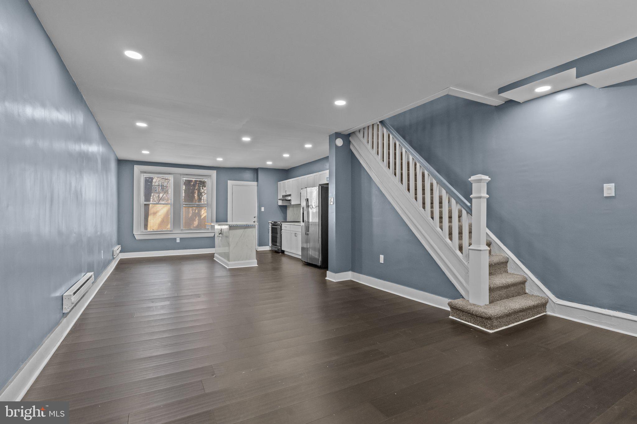 Welcome to 5149 N Fairhill St, PRICED TO SELL: A home that stands out from the rest with its expansive front and back yard, sun-drenched foyer, and a complete top-to-bottom renovation designed for both style and comfort. Step inside to an airy, open-concept living space, where the sleek kitchen island with LED lighting becomes the heart of the home. Every detail has been refreshed, from the brand-new windows and doors to the luxury flooring throughout. The fully finished basement with a half bath adds extra versatility, perfect for a home office, gym, or entertainment space. Nestled in the heart of Olney, this home offers unbeatable convenience with easy access to shopping, dining, and major roadways. If you're looking for a move-in-ready home that blends modern upgrades with charm, this one is calling your name!