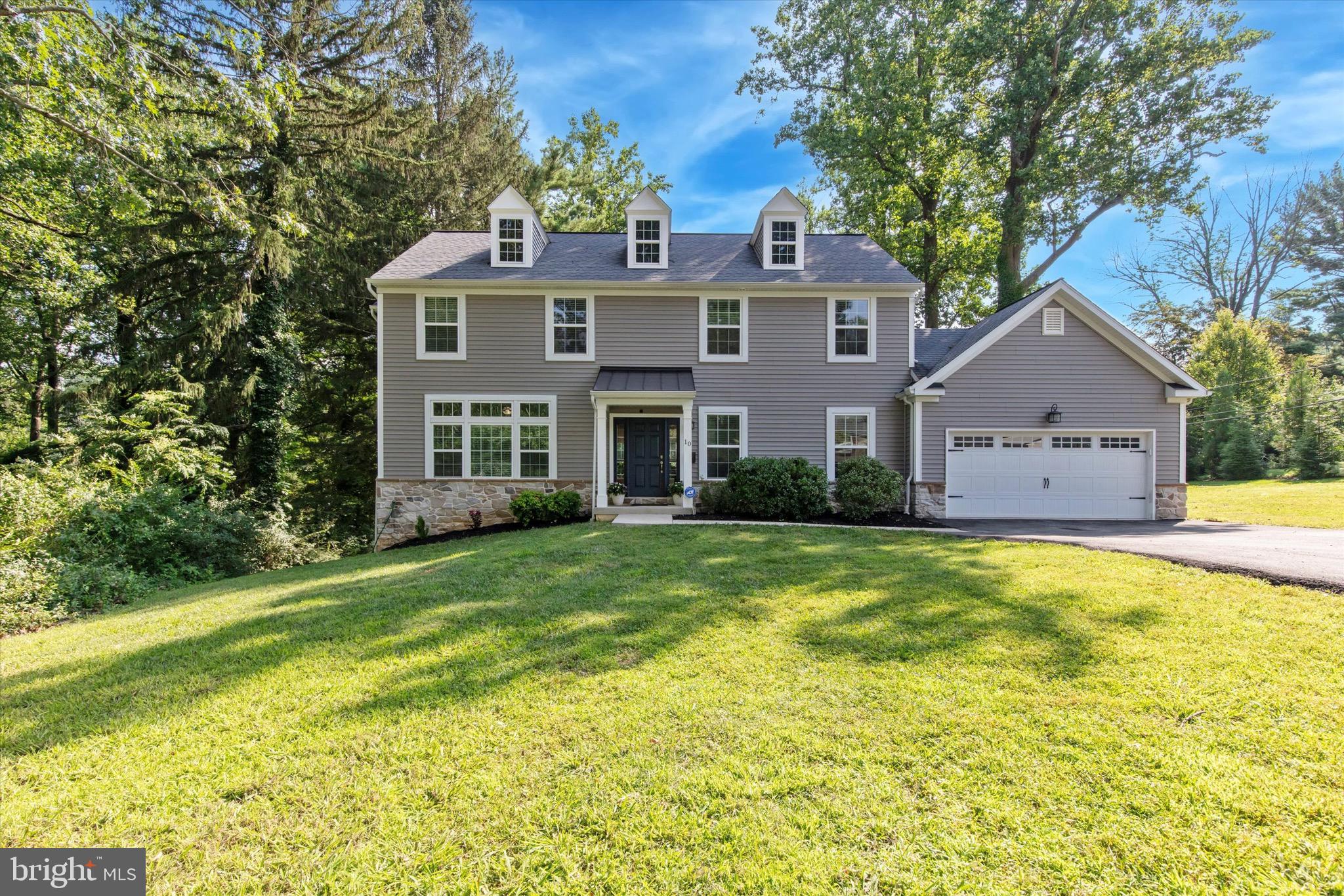 Welcome to 10 Robins Ln, a 9 year young and updated 4-bedroom, 2.5-bath Colonial home located in the heart of Berwyn—within walking distance to both the middle and high schools in the top-rated Tredyffrin-Easttown School District. Enter this stately colonial and you are welcomed by a modern open floor plan, tall ceilings, large windows, updated finishes and fresh paint throughout. The gourmet kitchen features modern finishes, quartz countertops, new appliances, peninsula seating, and opens to the bright, welcoming living room with fireplace and the dining spaces, perfect for entertaining and everyday living. A large home office/study offers a quiet retreat for working from home or homework sessions. A generous mudroom off of the 2 car garage helps keep daily life organized and offers an abundance of storage. Upstairs, the spacious primary suite includes a fully renovated spa like bath with double vanity, marble tiled walk-in shower, frameless glass shower door, private water closet and a generous outfitted walk-in closet. Three additional bedrooms share an updated hall bath with double vanity, ceramic tile tub/shower combo and LED lit mirror. A second-floor laundry room with full sized washer and dryer and large storage closet adds convenience. The finished basement provides additional flexible space for a playroom, gym, or media room, plenty of storage and outside access. All of this is set on a quiet wooded corner lot. This move-in-ready home combines comfort, function, and an unbeatable location. Prior to the seller's purchase this home was taken down to the foundation and a new home built on that foundation. All systems and mechanicals were replaced- everything is maximum 9 years old and many updates have been done since!
