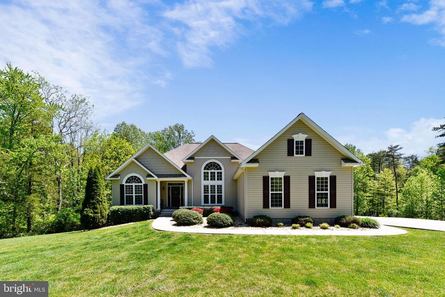 ONCE IN A WHILE the perfect HOME comes along - just what you are looking for.  This distinctive  HOME has all the "I  WANTS";  4 BR's, 3 full BA's and 4 Car Garage, main level living with split BR plan, totally Finished Lower Level, High Ceilings, Wood Floors, Gourmet Kitchen with Granite Tops,  gas Fireplace, wired for Surround Sound,  luxurious MBR  with double tray ceiling & BATH, Screened Porch off great room,  Grilling Deck.  Separate Laundry Room - all this on the main level, then it gets better....... Enjoy the beautifully Landscaped Lot, perfectly placed on this 4 Acre lot,  surrounded by Trees for Privacy, In-Ground Heated Pool, Patios, Walkway to Pool. The Detached 2-Car Garage is set up with removable wall,  presently a portion is used as work shop with electrical & water, garden storage area plus parking for one car, paved concrete driveway with extra parking.  This property has a Deeded ROW access to Mountain Run Lake  just a short walk to the Lake, High Speed Internet available,  Generac -  whole house Generator.   Ask your Realtor for plats, and a list of the detailed Features List. YOUR WILL WANT TO CALL THIS HOME!