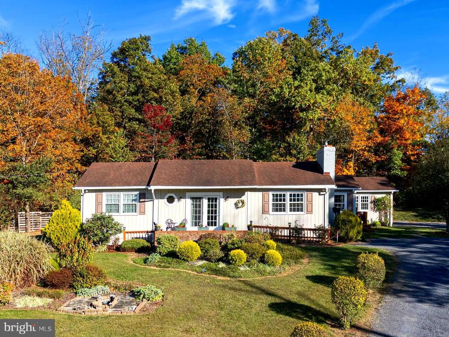 Welcome to this exquisitely updated 3-bedroom, 2-bath home nestled on over 3 acres in the highly sought-after Hope Mills Acres subdivision in northern Page County. This inviting property offers the perfect blend of comfort, functionality, and peaceful country living. As you enter the home you are greeted by an open-concept floor plan that seamlessly connects the living, dining, and kitchen areas—ideal for everyday living and entertaining. All bedrooms are conveniently located on the main level, along with a dedicated utility room and a versatile bonus space that can be used as an office, hobby area, or flex space. A woodstove insert and fireplace provide a cozy spot to relax by the fire during the fall and winter months. The spacious, unfinished basement provides abundant room for storage, hobbies, or future expansion. Enjoy the best of the outdoors from both the welcoming front porch and the covered back porch, accessible from each side of the home—perfect spots for morning coffee or relaxing evenings. The property’s long list of amenities also features mature landscaping, a garden shed, tool storage area, and a greenhouse equipped with power and water for year-round gardening. An attached one-car garage completes this charming home and provides additional versatile space. Recent improvements include newly installed luxury vinyl plank flooring, a freshly painted exterior, luxurious crown molding, new windows, and efficient mini-split systems for year-round comfort. Located in northern Page County, just minutes from Springfield Elementary, the Town of Luray, and only an hour and a half from downtown Washington, D.C., this exceptional home offers the rare combination of peaceful country living with convenient access to schools, amenities, and city life. Do not miss the opportunity to make this home your own!