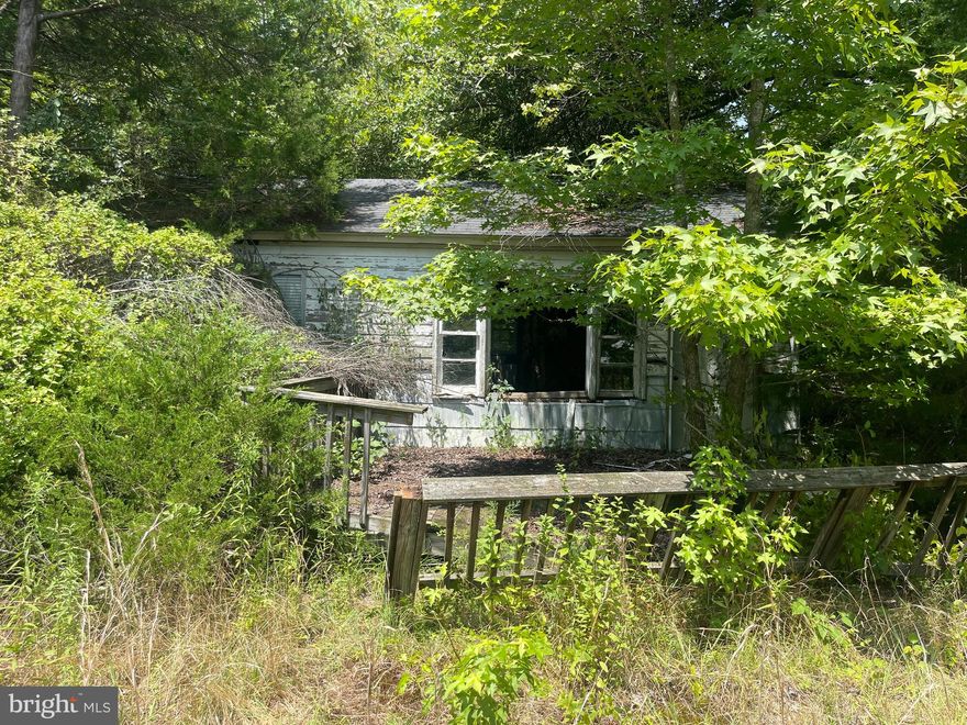 Don't miss your second chance at this one, back active at no fault of the seller. This is a .64 acre parcel, there is a small 560SF structure on the property that is unsafe to enter and will need to be demo'd, selling for land value only. Great opportunity for a visionary investor to re-build.

County has no record of any septic, but does show that there is a well, well has not been located. Priced below tax assessment.

*DO NOT ENTER THE SMALL STRUCTURE*