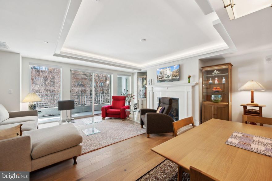 Please DO NOT contact sellers. We are planning on relisting after their travels.
Gorgeous 2 bedroom 2 full bath condo in The Lauren Condominiums. This immaculate condo welcomes you with tons of natural light and gorgeous hardwood floors throughout.  The kitchen was customized in 2020 with stunning cabinetry, stainless steel appliances with gas cooking, and quartz counters. The spacious living room has a gas fireplace and is ideal for entertaining. The elegant primary bedroom looks over Woodmont Ave and has an ensuite bath along with a custom walk in closet. The primary bathroom has a separate tub, separate shower, dual vanities, and TV/mirror. The generous sized 2nd bedroom has downtown Bethesda views and a murphy bed which conveys.  Laundry room with custom cabinetry and side by side front loading washer & dryer. *Custom lighting throughout including trey ceiling lighting* Custom Closets* Custom Blinds with black out shades in the primary bedroom*New air handler (2025)* 2 garage parking spaces & 2 storage units. Storage Closet #3 is accessed via garage level B1 and Storage Unit #32 is located in the storage unit room on Level G. Wine locker #15 located in the Onyx Lounge. Community Amenities include: Rooftop Terrace, Fitness Center, Onyx Lounge, Concierge, Guest Parking available in building garage. Ideally located in Downtown Bethesda with stores, restaurants, nightlife, metro, etc.