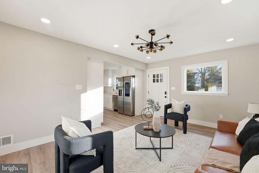 Beautifully renovated 5-bedroom, 2-bath home offering modern style, thoughtful craftsmanship, and turnkey living in the heart of Riverdale... Step inside to a bright and open living area featuring recessed lighting, wide-plank flooring, and a contemporary color palette that creates an inviting atmosphere for everyday living and entertaining. Large windows fill the space with natural light, enhancing the home’s clean, modern design... The stunning all-new kitchen is a true highlight, showcasing white shaker cabinetry, quartz countertops, a full quartz backsplash, brass hardware, and brand-new stainless steel appliances. With generous storage and prep space, this kitchen blends function with high-end style... This home offers five well-proportioned bedrooms, each with ample closet space—a rare find... Both bathrooms have been fully renovated with designer tile, modern vanities, stylish fixtures, and elegant finishes that create a spa-like ambiance for your daily routine... The exterior features fresh updates, a newly paved driveway, and a welcoming front entry. The location provides unmatched convenience—just minutes to shopping, dining, parks, schools, and major commuter routes with easy access to DC, College Park, and the Hyattsville Arts District... This home checks every box. Schedule your tour today—this one won’t last.