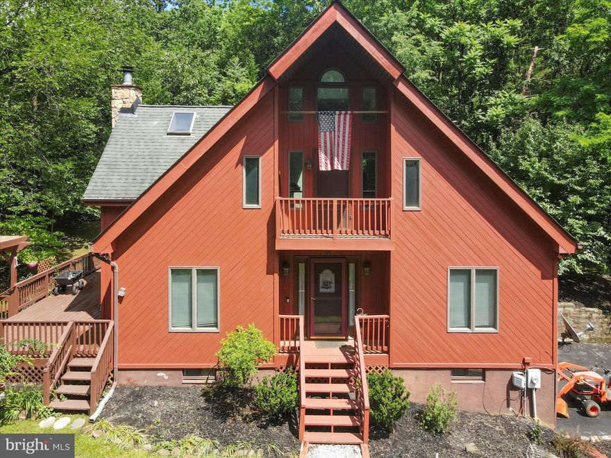 Welcome to 54 Sumac Lane – your private retreat nestled in the scenic hills of Harpers Ferry! This beautifully maintained home sits on a peaceful lot surrounded by nature, offering the perfect balance of privacy and convenience. Inside, you’ll find a spacious layout with abundant natural light, a cozy living area with a fireplace, and a well-appointed kitchen featuring modern appliances and plenty of storage. The primary suite provides a relaxing escape with an en-suite bath and generous closet space. Step outside to enjoy the expansive deck — perfect for morning coffee or evening gatherings under the stars. Whether you're looking for a weekend getaway or a full-time residence, this property offers year-round comfort just minutes from hiking trails, the Shenandoah and Potomac rivers, historic downtown Harpers Ferry, and major commuter routes. Don’t miss your chance to own a slice of Wild & Wonderful West Virginia!