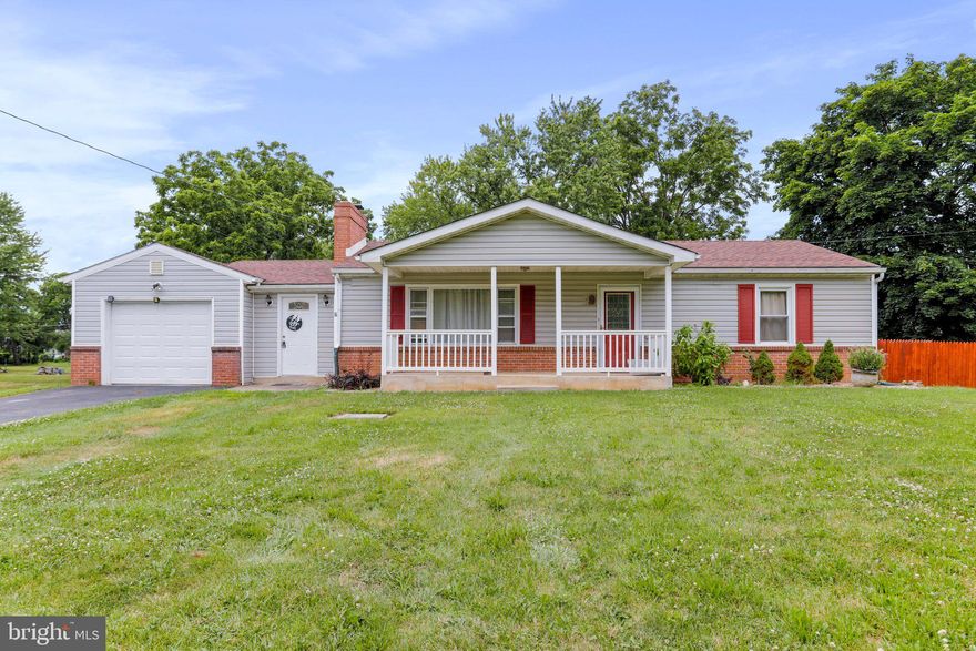 4 bed 1 bath Rancher located in a quiet neighborhood. Breezeway that opens into the dining room with fireplace and hardwood floors. Over size garage with storage area. Front porch and back deck.