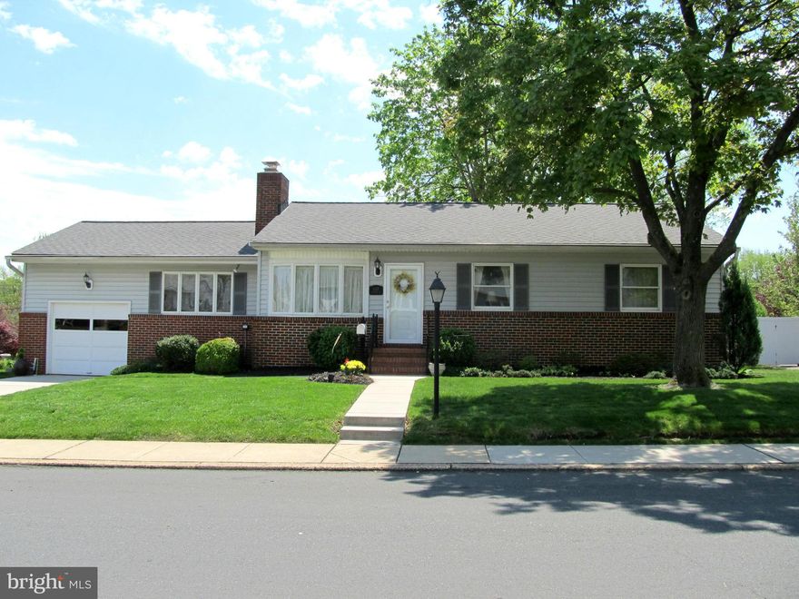 This lovely rancher is immaculate!!  Featuring updated kitchen with quartz counter tops and tile backsplash, updated bath, spacious living room with fireplace and separate den, finished basement with full bath, gorgeous patio enclosure overlooking landscaped yard and in-ground pool, garage..this house has it all!  Absolutely move-in ready!  Convenient to most major routes..Hurry; come see!!