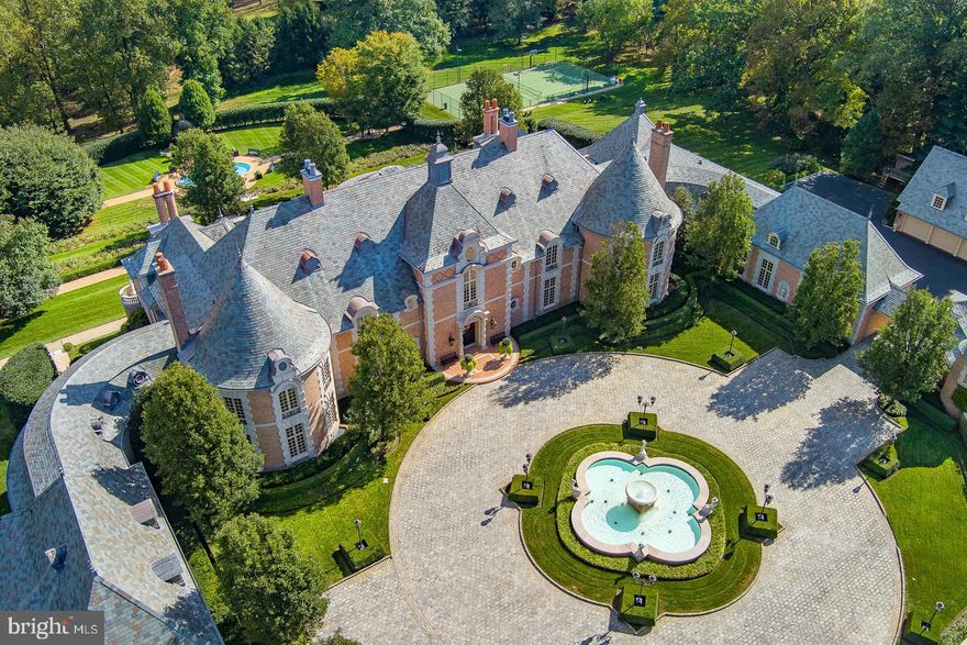 Poised gracefully amidst the picturesque landscape of Gladwyne, this architectural marvel effortlessly blends sophistication with meticulous craftsmanship. From the moment one steps onto the grounds, the estate's understated elegance beckons exploration, with every detail carefully curated to evoke a sense of timeless allure. Craftsmen from around the world have contributed their expertise to create a residence that stands as a testament to luxury and refinement.
The journey commences at the entrance, where ornately carved doors, crafted by artisans of unparalleled skill, offer a glimpse into the opulence within. Entering the foyer, guests are greeted by a symphony of textures and hues, with hand-painted frescoes adorning soaring ceilings and natural light cascading through expansive windows, framing panoramic vistas of the surrounding landscape.
At the heart of the estate lies the culinary haven, where meticulously crafted cabinetry and top-of-the-line appliances converge to create a space as functional as it is stylish. Here, culinary masterpieces are born amidst an atmosphere of refined charm and effortless grace.
Each room within the residence tells its own story of impeccable design and attention to detail. From the lavish master suite, boasting a private terrace overlooking meticulously manicured gardens, to the inviting guest quarters adorned with bespoke furnishings and accents, every space exudes an air of timeless sophistication.
Beyond the main residence, three outbuildings provide additional accommodations for guests or staff, seamlessly blending with the estate's architectural aesthetic. Within these structures, nine-car garages are distributed, offering ample space for automotive enthusiasts to indulge their passion.
Outside, the meticulously landscaped grounds offer a sanctuary for relaxation and rejuvenation. A sprawling terrace provides the perfect setting for al fresco gatherings, while carefully curated gardens, designed by renowned landscape architects, invite moments of quiet contemplation amidst nature's splendor.
In every aspect, this exceptional estate is a collaborative masterpiece, where craftsmen from diverse backgrounds have come together to create a sanctuary of unparalleled luxury. From its architectural grandeur to its meticulously appointed interiors, it stands as a testament to the timeless allure of fine craftsmanship and refined living.