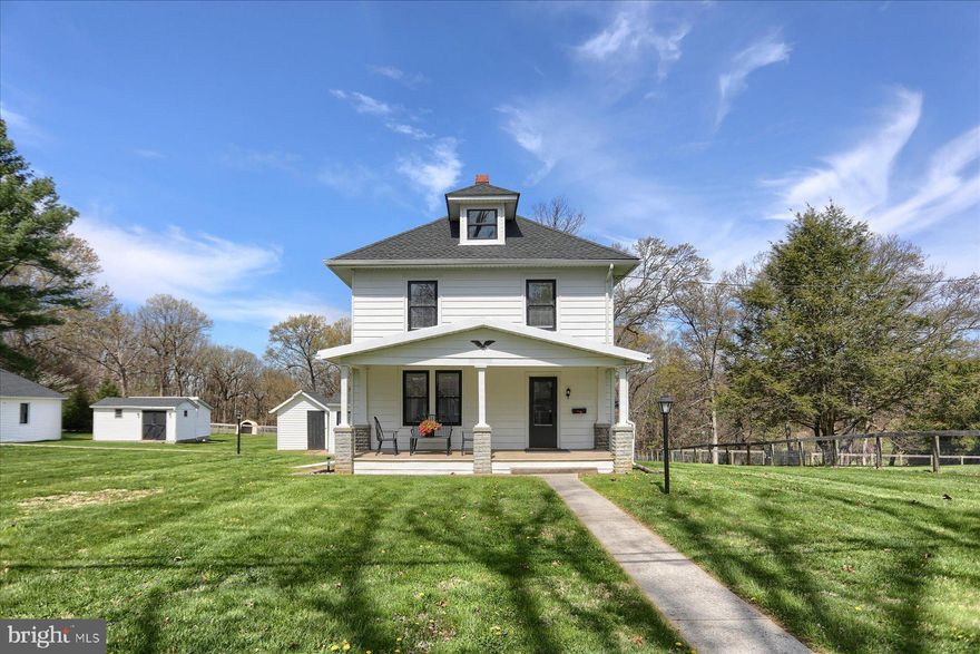 Charming Colonial, completely reimagined from the studs up, blending classic appeal with modern comfort. Highlights include a welcoming covered front porch, new roof, updated wiring, and  new insulation. Interior features include 2 new bathrooms with radiant heated flooring, second-floor laundry hook-up, new flooring /carpeting throughout, and recessed lighting. The kitchen has been fully upgraded with new stainless steel appliances and granite countertops. Includes 3 bedrooms, 2 full baths, living and dining rooms, and a finished attic offering additional living space.Set on a generous, level lot with a detached 2-car garage and multiple outbuildings.