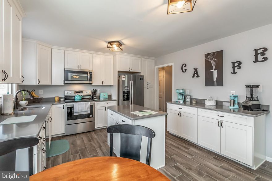 Excellent opportunity to own a unique California Contemporary in Parkville*This 5 bedroom 3.5 bath home has been meticulously cared for by its owners*Brand new kitchen boasts new 42" cabinets, Quartz counters, soft close drawers, pull out shelves, porcelain-tiled floor, bay window and kitchen island*Brand new powder room off of large porcelain-tiled foyer with a walk-in coat closet*Large open floor plan with living/dining combination*Wood burning fireplace and 2 sets of french doors complement the living space*The french doors lead to a large 16 X 24 deck which overlooks the expansive backyard, the pool, pool deck and pool house*Upper hall bath completely renovated with granite counter and porcelain floor*Master bedroom boasts 3 closets, 2 are walk-ins, a master bath w/custom tile, granite counter and luxury shower*A set of french doors off of master bedroom leads to a large office*Finished LL w/bedroom, full bath and walk-out access to rear*300 sq ft pool house is fully finished with kitchen, electric, water  heat and add'l storage*Large pool with pool deck and electric*Fully fenced rear*Dual zoned heating and air*Furnace and water heater are new*2 car attached garage with a 4 car driveway*This property has two tax records as second lot has own tax ID*Pool, pool deck and pool house are being sold AS IS*Many more updates*Come See!*Owner is a RE licencee*Do not let the front of this property fool you!  It is much larger inside than it appears!