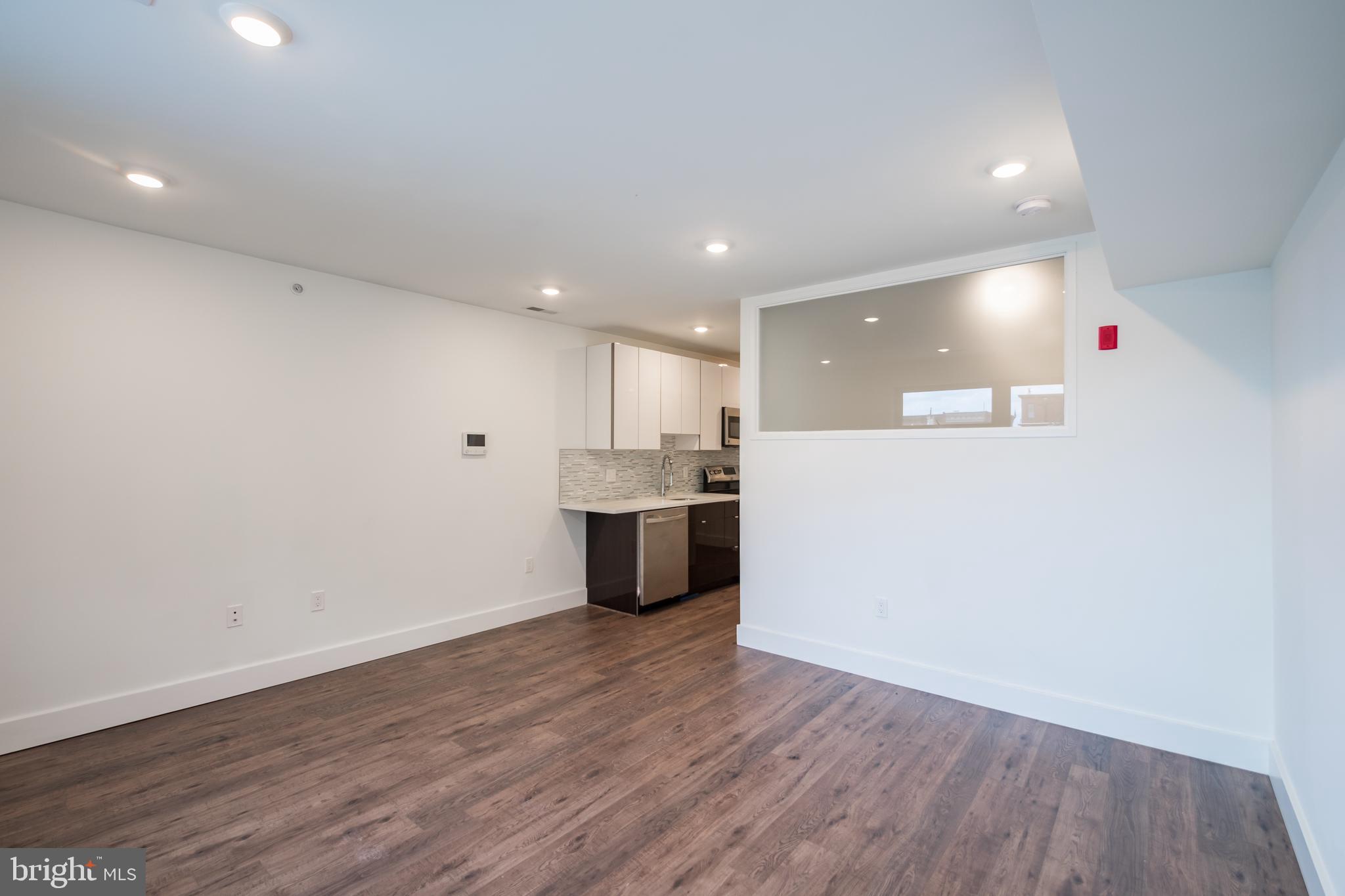 *Available NOW!*
Don’t miss this brand new luxury apartment building at the corner of 15th and Federal, just one block from Broad Street subway station in Point Breeze and just minutes from Graduate Hospital and East Passyunk! The building includes a shared rear yard and high end finishes throughout! Located on the second floor of the complex, this gorgeous interior features amenities such as central air, designer lighting, washer/dryer in unit, and hardwood floors throughout. A super modern gourmet kitchen is furnished with a garbage disposal, stainless-steel appliances that include a dishwasher, refrigerator and microwave, in addition to granite counter-tops and elegant designer cabinetry. The spacious bedroom features window to the living room for diffused lighting, a space saving sliding barn door and includes a closet! The beautiful full bathroom has a modern vanity sink with cabinet doors and drawers, and bathtub/shower combination.
Lease Terms: Generally, 1st month, and 1 month security deposit due at, or prior to, lease signing. Other terms may be required by Landlord such as last month’s rent upfront. $65 application fee per applicant. electricity, gas (if applicable), cable/internet and $10/mo technology fee. Water is a flat monthly fee of $60. $25 service fee plus cost of the air filter will be charged quarterly for routine air filter replacement. Landlord Requirements: Applicants to make 3x the monthly rent in verifiable gross income, credit history to be considered, no evictions within the past 5 years, and must have a verifiable rental history with on-time rental payments. Exceptions to this criteria may exist under the law and will be considered. Cosigners will be considered.
*Price reflects the net effective rent after a 2-week credit is applied at $1,350/mo.
*1 Dog under 35 lbs. OR 1 Cat – $350 non-refundable pet fee + $50/mo pet rent required.
*Building is set up for Verizon ONLY
*Photos of a similar unit. Finishes may vary.