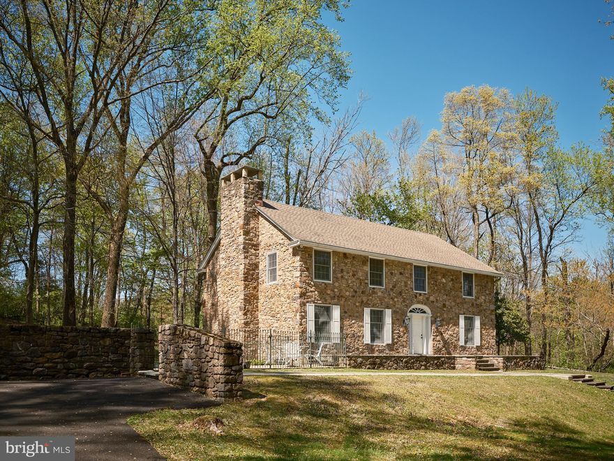 Located down a private lane off Comfort Road is this inviting stone colonial home offering a serene retreat amidst the lush backdrop of wooded landscapes and a captivating view of the neighboring pond.
This 3 bedroom home exudes warmth and charm, with large windows inviting ample natural light and framing picturesque views of the outdoors. The open floor plan creates a seamless flow between living spaces, making it ideal for everyday living.  The living room boasts a massive Stone fireplace perfect for cold winter nights.  The kitchen, equipped with modern appliances and plenty of counter space, is a chef's dream, while the adjacent dining area offers a cozy spot to enjoy meals with family and friends.
Retreat to the master bedroom featuring another stone fireplace and large windows framing views of the tranquil surroundings, creating a peaceful sanctuary for rest and relaxation. There is a Large Master bath and walk in closet. Two additional bedrooms share a large hall bath providing comfortable accommodations for family members, ensuring everyone feels at home.
Outside, the yard beckons you to enjoy the great outdoors. Whether it's lounging on the patio by the inground pool, hosting gatherings on the veranda or simply taking a leisurely stroll through the woods, there are endless opportunities for outdoor recreation and relaxation. There is a 3 car detached garage with a loft space and 3 parking spaces. The home has an additional driveway with parking for up to 6 cars.
Conveniently located just minutes from New Hope which offers shopping, dining, and recreational facilities, this home offers the perfect combination of natural beauty and convenience. With its idyllic setting and charming features, 2981 Comfort Road is more than just a home – it's a peaceful retreat where you can truly unwind and reconnect with nature.