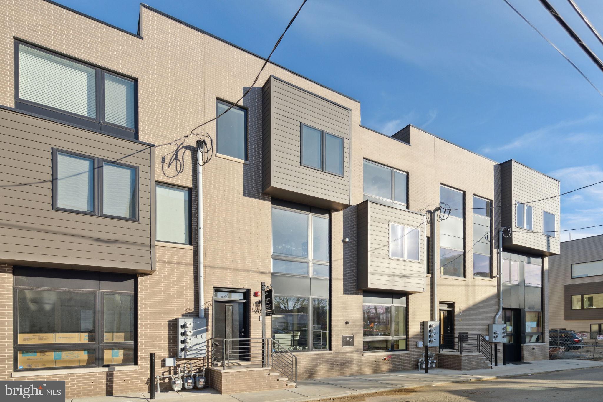 This bi-level condo features two large bedrooms, three bathrooms, and offers the best lifestyle available in its price. Enjoy the natural wood floors, high ceilings, recessed lights, and smooth drywall finish. The kitchen features high quality finishes, including quartz countertops, 5-burner gas range, soft-close shaker-style cabinetry, new appliances, plumbed island, and bar seating. Private entrance directly to gated courtyard. Thoughtfully placed storage includes coat closet upon entering, and generous closets off of the downstairs landing. The LG washer/dryer is gas powered to dry faster while keeping utility costs low. Large picture-frame energy efficient windows, both east and west-facing. Two and a half bathrooms, one en suite to primary bedroom, feature beautiful vanities and contemporary fixtures. The downstairs bedrooms are quiet and peaceful, with custom-built closet organizers, including a his-and-hers in the primary suite! Of course, the HVAC is new and energy efficient, including central air conditioning. The property is blocks away from the Temple University train station with service to Center City and 30th St every 10 minutes. One block to the grocery store. Moments away from the best gathering spots like Human Robot, Philadelphia Brewing Co, The Ground Coffee, LMNO, Stateside Distillery, and Kalaya Thai Kitchen. There is no need to compromise on your condo, while still enjoying every benefit of a connected convenient location.