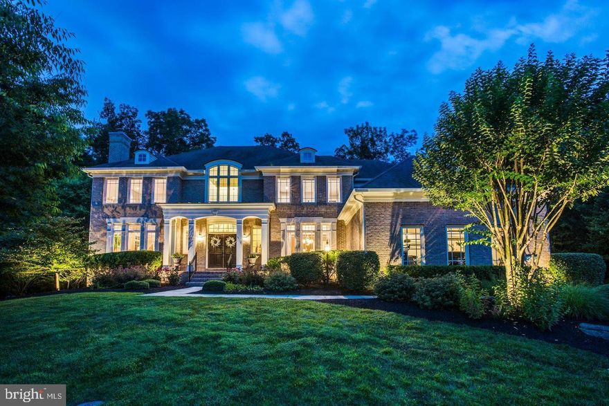 Brick-wrapped and boldly refreshed, this stately Red Cedar West estate brings a distinctively modern edge to the quiet rhythm of rural Loudoun. From its coveted cul-de-sac welcome, you’ll return from winery afternoons and historic township strolls to incredible oversized polished marble floors tracing an open floor plan illuminated by gallery-worthy fixtures, glowing hearths, and two stories of great-room window panes. Though the sweeping onyx-hued staircase invites guests to linger at the threshold, your main level is poised to host exquisite parties, overnight guests, and favorite weeknight meals. While the office - with potential for overnight guests - is cared for by one of six striking bathrooms, in the chef’s kitchen you’ll pour wines from the butlers pantry, gossip from across the black-tie island of stone, and complete best loved recipes using gorgeous designer appliances. Within the soaring living room, gather guests at the holidays where views include wooded privacy from beyond the pool. On 2.42 acres, landscaping frames summer fun where you’ll host conversation around a fire pit, soak-in sunshine on low-maintenance turf, illuminate evening BBQ’s with atmospheric cafe lights, and host floats under the stars.  With a lower level destination for film screenings, mirrored dance/gym space, bar, and access to the grounds, upstairs you’ll tuck-in little loved ones and retire to your primary suite where dual dressing closets, fireplace, and sitting room await your slow Sunday mornings. While on tour, visit the three car garage and imagine sunny weekend breakfast in the expansive morning room. Dramatic in design, yet grounded in an unhurried rural lifestyle, home is just moments from Loudoun Country Day School where routes lead to Historic Leesburg, rolling countryside, Leesburg Executive Airport, and the understated bustle of favorite shops, dining, and theater within Brambleton.