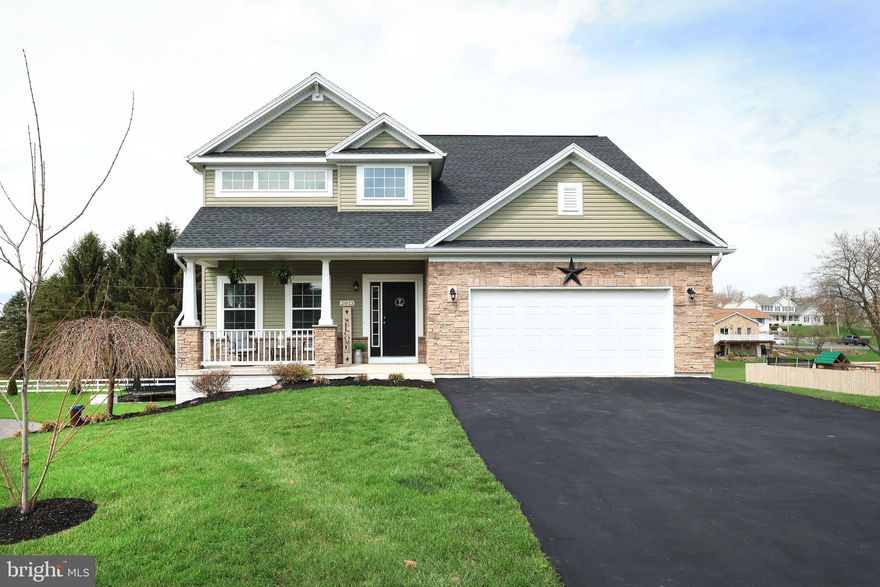 Some homes simply come together in all the right ways, comfort, style & location in perfect harmony. Perfectly positioned on a .39-acre lot in the heart of Zion, this one-owner Craftsman-style two-story home, built in 2018, offers exceptional curb appeal & a warm, inviting presence from the moment you arrive.  A charming covered front porch sets the tone, creating the perfect spot to relax & take in the panoramic views of neighboring mountain ranges.  Step inside to a soaring two-story foyer that makes an unforgettable first impression, complemented by neutral interior paint choices, rich hardwood flooring. 9’ ceilings & an abundance of natural light that pours throughout the home. Every detail has been thoughtfully designed to create a space that feels both stylish & welcoming a home that moves effortlessly from daily living to memorable gatherings.  The free-flowing floorplan leads you into a delightful dining room & transitions into the stunning, chef-inspired kitchen. Featuring crisp white cabinetry, stainless steel appliances, granite countertops, a tile backsplash, pantry & a center island with storage & breakfast bar, this space is designed for both functionality & style.  Sliding glass doors open to a spacious rear composite deck overlooking the beautifully manicured backyard & private above-ground pool perfect for relaxing or entertaining all summer long. The adjoining family room offers a cozy fireplace, creating a warm & inviting gathering space, while a convenient main-level half bath adds everyday practicality.  The hardwood staircase leads to the second floor where you will discover a relaxing primary suite complete with a private full bath featuring a dual vanity, walk-in shower & a generous walk-in closet. Three additional well-appointed bedrooms, a full bathroom & a convenient second-floor laundry room complete the upper level.  The finished walk-out lower level expands your living space with a versatile recreation room featuring luxury vinyl plank flooring & a fireplace, exercise area, pre-plumbed for a future bathroom & direct access to a rear-covered patio offering even more room to unwind & enjoy.  Ideally located just minutes from local amenities, schools & an easy commute to State College, Penn State University & Lock Haven University, this exceptional home offers the perfect blend of comfort, style & convenience. Boasting three levels of thoughtfully designed living space, it brings together everyday functionality with inviting spaces meant for connection, relaxation & enjoyment.  Whether you're savoring quiet mornings on the front porch, entertaining on the back deck, cooling off in the pool, or unwinding in the finished lower level, this home is designed to be enjoyed inside & out. Don’t miss your opportunity to make this very special home your next chapter, schedule your private tour today & experience it for yourself.