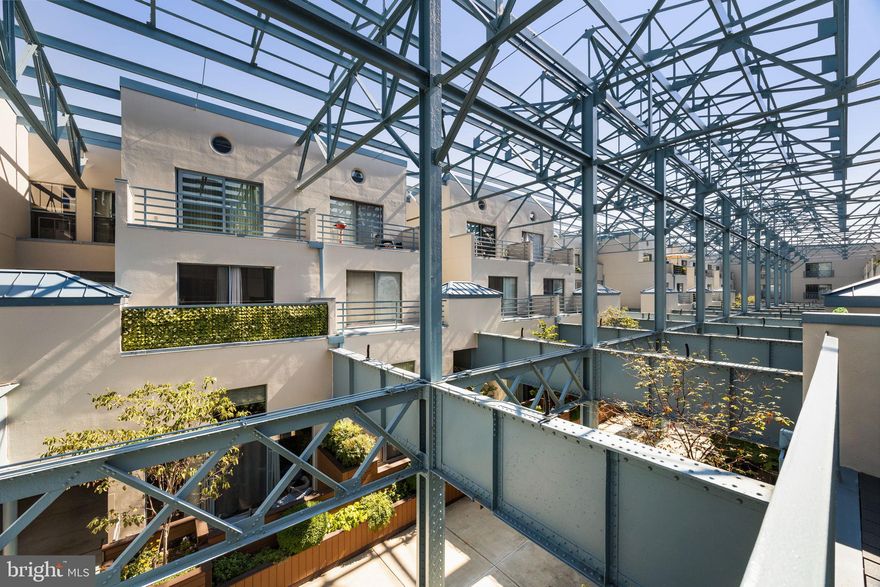 Say hello to Unit PL236 at Pier 3!  This sun-drenched, bi-level one-bedroom, one-bath residence comes with garage parking and two private outdoor spaces.

As you enter, the foyer welcomes you in with stylish black-and-white tile flooring, a convenient coat closet, an in-unit washer/dryer, and a modern kitchen featuring updated appliances, ample cabinetry, and a serving bar. The open-concept living area boasts soaring 12+ ft ceilings, updated bamboo floors, and an expansive wall of windows with sliding glass doors that lead to the first of two private terraces overlooking the building’s verdant interior atrium, capped by its signature open-air steel beam structure. Upstairs, you’ll find the spacious bedroom with a generous closet, the second private outdoor terrace, a hall linen closet, and a full bath with an updated shower stall.

Pier 3 amenities include an indoor heated pool, a fitness center, secure covered garage parking, a common outdoor water-facing deck, a central landscaped atrium, a full-service 24-hour concierge, and professional on-site management. It’s time to enjoy waterfront life and take advantage of the newly finished Delaware River Trail's public amenities, including running, walking, and biking lanes, lush landscape beds, and remember, be on the lookout for your future neighbor, the much-anticipated Park at Penn’s Landing! *Some photos are virtually staged.*