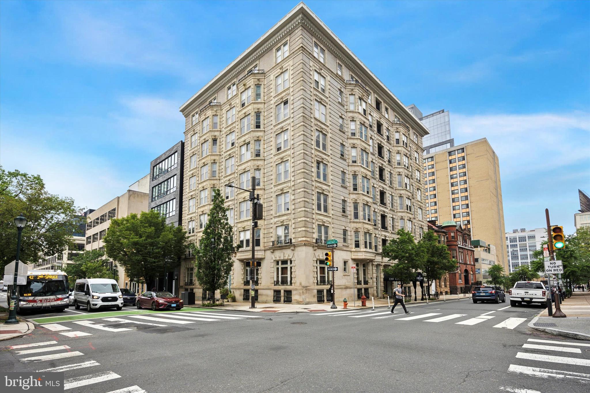 Welcome to the Coronado, a classic 37-unit boutique condominium building built in 1910, listed in the Philadelphia National Registry of Historic Places, and located in the Rittenhouse Square section of Center City, Philadelphia. This sophisticated classic style two-bedroom, 1.5 bathroom condominium is situated on the 3rd floor overlooking the gorgeous gardens of the Philadelphia Physicians College and the historic First Unitarian Church with eastern exposure providing lots of natural light and a beautiful view of the City and the above-mentioned garden. Walking through the entrance doors to the Coronado, you will be welcomed by the building's gracious and newly restored marble lobby! Taking the elevator to the third floor and to the unit’s front door, the spacious foyer sets the moment! You will be greeted by an over 1,200 square foot well-appointed home featuring hardwood floors, high ceilings, a bay window, and beautiful ornate millwork. The living room boasts a large window, and the bright dining room also showcases a large bay window and a gas-burning fireplace. (Note the dining room is currently being set up as an additional living space, but it can easily be converted back to a formal dining room.) The modern kitchen provides ample granite countertops and abundant cabinet space. It has stainless appliances and a door leading outward to a small balcony. Completing this section is a spacious half bathroom with a stackable washer and dryer. Heading down the hallway, you will find two well-sized bedrooms with deep closet space and a freshly painted hall bath with a window. Location! Location! Location! Offering a walk score of 99! 30th Street Station, Rittenhouse Square, Schuylkill River Walk/Bike path, Giant and Trader Joe super markets, well-acclaimed restaurants, The Art Museum, and so much more you could need is at your doorstep—an easy walk or subway commute to UPENN, and Drexel. Hop onto I-76 and 676 within minutes. Condo fees include building maintenance, trash/snow removal, water, building insurance, management fees, and security. Standard common storage and a bike room are available in the basement of the building for owners. Residents enjoy a secure environment, including a security system and convenient package delivery in the lobby. Schedule your viewing today and embrace the charm and elegance of this historic Philadelphia landmark!