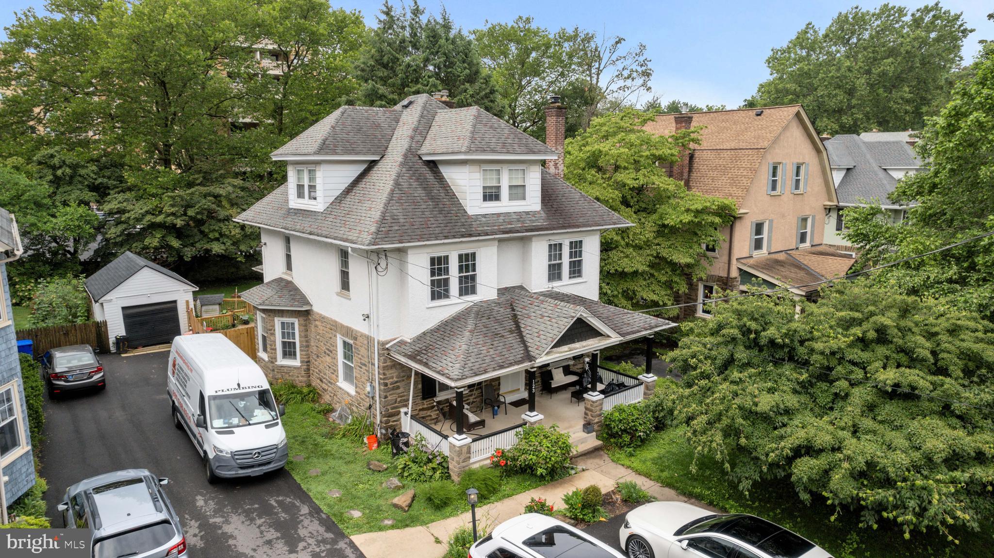 Welcome to 123 Township Line Rd — a warm and inviting home where timeless character meets everyday functionality. With over 3,100 square feet of finished space, 6 true bedrooms (including two versatile rooms on the third floor), 2.5 bathrooms, and a private, fenced-in yard, this property offers the kind of room and flexibility that’s hard to find.
Step onto the charming covered front porch and into an airy entryway that sets the tone for what’s inside. The entire first floor features rich cherry hardwood flooring, recessed lighting, and an effortless flow between spaces. Whether you’re hosting a holiday dinner in the elegant 15x15 formal dining room with bay window and wainscoting, or catching up over coffee in the 12x14 sitting room, this home was built for connection.
The kitchen offers granite counters, stainless steel appliances, and a tucked-away rear staircase—plus a butler’s pantry and a spacious 9x12 laundry/mudroom that keeps daily life running smoothly. A clever powder room conversion near the stairs adds to the thoughtful layout.
Upstairs, you’ll find four large bedrooms with original hardwood floors and a beautifully remodeled hall bath featuring a modern soaking tub, walk-in slate-look shower with bench, and double sinks—perfect for busy mornings or relaxing evenings.
The third floor offers two more finished rooms (both with closets), a gorgeous full bath with walk-in shower, and plenty of options for guests, home offices, or creative spaces.
Out back, enjoy quiet evenings under the covered patio, grill in the private yard, or let the dog run free in the flat, fully fenced space. A detached 1-car garage adds bonus storage and off-street parking.
Gas heat and hot water. Located in Cheltenham Township with convenient access to shops, parks, and the city, this home blends classic appeal with the lifestyle you’re looking for.