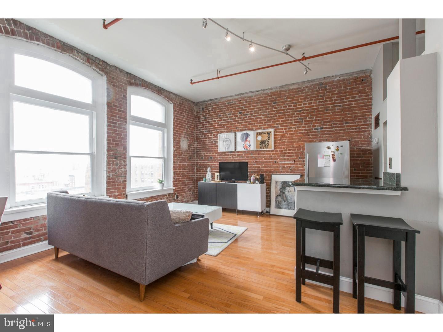 Beautifully updated apartment at 1010 Race! This bright and inviting apartment features over-sized windows, exposed brick, extra high ceilings and flawless hardwood flooring. Enter though the elegant, renovated lobby and into the elevator up to the 6th floor where you will be welcomed by an open living and kitchen area. The updated kitchen features white cabinets, granite countertops, stainless steel appliances and bar top with seating for two! Further you will find the spacious bedroom which features two closets, one with custom built-in shelving as well as a full hall bath with shower/tub combo, vanity and washer / dryer closet. In addition to all of this there is bike storage and a door person during the week 9-4PM. At this location, you will be in the heart of Chinatown which provides easy access to Center City shopping and restaurants, I-76 & I-95, Ben Franklin Bridge and great parks! Don't wait, schedule your showing today! There is a moving fee of $350 to be paid to the building directly. Apartment is available August 4, 2025.