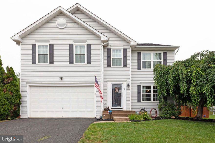 This house is loaded with extras, starting with the drive. ( 5 miles from 95), into a private cul-de-sac,  entrance of house has a 20 yr old weeping cherry tree. with a fully fenced back yard with 3 exits and fire pit. It is perfect for kids, barbecuing and pets.  The main floor features brand new  laminate flooring that is 100% waterproof, kid proof and pet proof. An open floor space configuration. with  living room, dining room and large sunroom for morning coffee. The family room it is the perfect space to entertain guests and bring family  together. The office or den is convenient for working from home. Gas fireplace for those  chilly  evenings. The kitchen has recently upgraded stainless steel appliances, gas stove, large pantry with floor to ceiling shelves and lots of cabinetry. As you walk up the newly redone  stairs,  First you have a massive Master Bedroom with his and hers walk in closets,  large master bathroom  complete with tub and separate shower. The other 3  sun filled Bedrooms are all large enough to fit a queen bed and each with its own large closet and each with ceiling fans. The second floor  laundry room is conveniently located near all these bedrooms as well. The backyard has a newly painted large deck with privacy fence all around,  beautiful landscape throughout and a cute storage shed. The Backyard has a 2 side entrance to the front of the house and a rear exit to the Middle School  track and field area. The Basement is a walkout and is ready for you to make it your own and has hook ups for another bathroom, the utility area includes a 50 gallon hot water heater , which is only 3 years old. Within the last 3 years the homes windows and roof has been replaced. The two car garage is the perfect size and the neighborhood also features a community pool,  playground and plenty of walking paths.