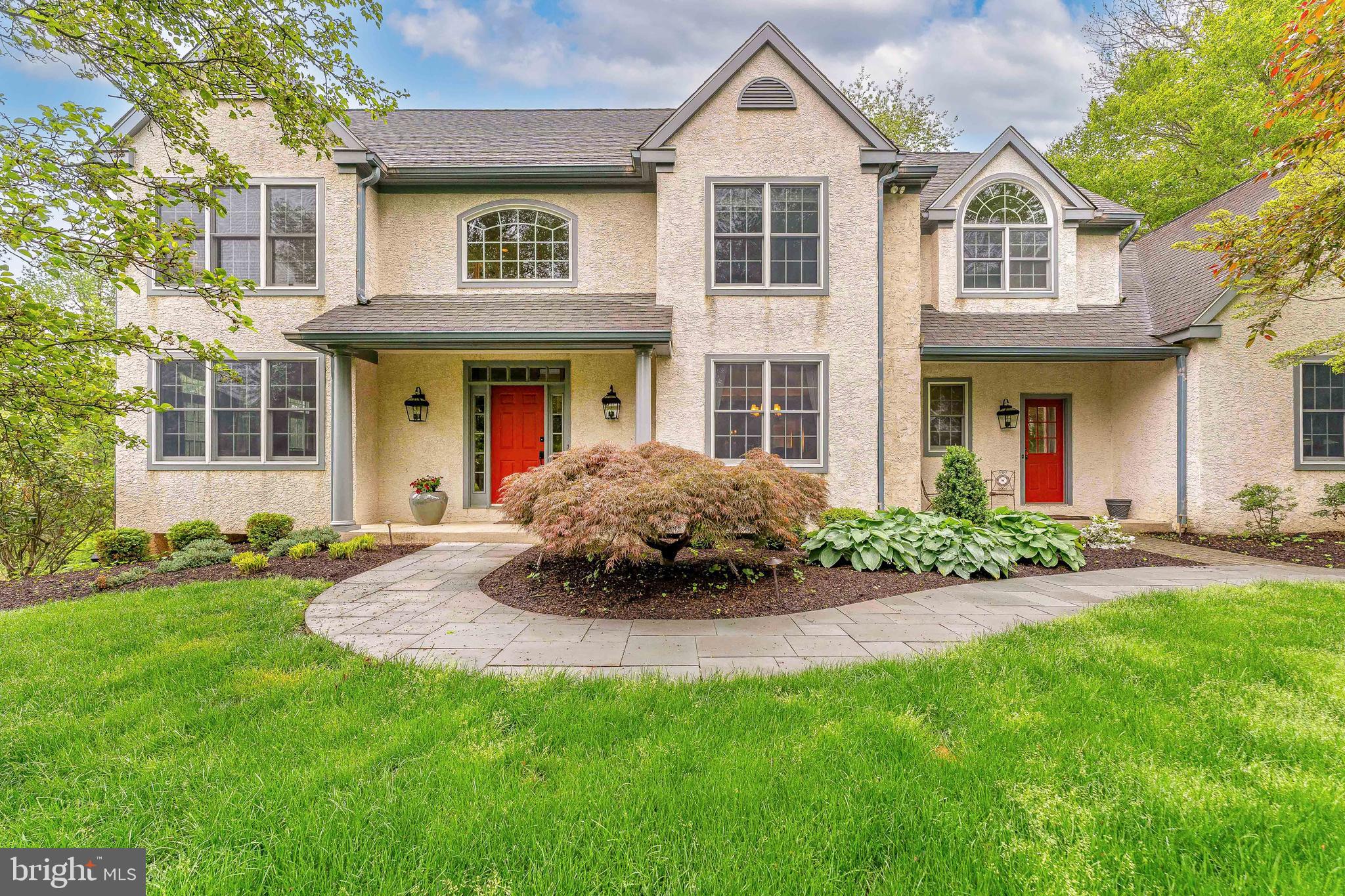 Welcome to 1052 Cedar Mill Lane, a stunning 5-bedroom, 4 full and 2 half-bath Colonial-style home nestled in the desirable Hamilton Place community of West Chester. Situated on a quiet cul-de-sac, this impressive residence offers over 6-car driveway parking and a spacious 3-car garage—ideal for families and entertainers alike. The property backs up to a wooded area with a stream and great views of the recently preserved Crebilly Farms, providing a serene and picturesque setting. Step inside to a grand two-story foyer, featuring gleaming hardwood floors, elegant crown molding, chair rail, and classic wainscoting. To the left, the formal living room welcomes you with plush carpeting, crown molding, and French doors that open into a cozy bar room—complete with slate flooring, granite-topped built-in bar, a sink, gas fireplace, and arched windows, perfect for entertaining guests. To the right of the foyer, the formal dining room exudes sophistication with hardwood floors, a tray ceiling, chair rail, and wainscoting. Continue down the hall to a charming powder room with hardwood floors and detailed trim work. At the rear of the home, a sun-drenched three-season sunroom features wood decking, a vaulted ceiling with skylights, a ceiling fan, and screened walls. —opening to a spacious deck. The heart of the home is the expansive two-story family room, showcasing a floor-to-ceiling stone gas fireplace, skylights, ceiling fan, and an open flow to the gourmet kitchen. The kitchen is a chef’s dream, boasting hardwood floors, granite countertops, an oversized marble island with breakfast bar and prep sink, stainless steel appliances, and a butler’s pantry with a built-in wet bar. Adjacent to the kitchen, a bright breakfast area features skylights, hardwood floors, and French doors leading to the rear deck. A well-appointed laundry/mudroom with laminate flooring and a second entrance adds daily convenience. Another half bath completes the main level. Upstairs, retreat to the luxurious primary suite, complete with carpet flooring, a sitting area, tray ceiling, ceiling fan, and a double-sided fireplace shared with the spa-inspired en-suite bathroom. The bathroom features tile flooring, a granite-topped double vanity, large walk-in closet, freestanding soaking tub, and a spacious walk-in shower. Two additional bedrooms share a beautifully appointed Jack-and-Jill bathroom with tile flooring, a double vanity, and a tub/shower combo. The fourth bedroom offers its own en-suite bath with a stall shower, making it perfect for guests or family. The finished lower level offers even more living space, starting with a home gym area and a dedicated office with built-in cabinetry. From here you have access to a stone patio with a relaxing hot tub. Enjoy movie nights in the home theater room, equipped with carpet flooring, theater seating, and a built-in sound system. The fifth bedroom, also located on this level, includes carpet flooring and a private en-suite bathroom—ideal for guests or an in-law suite. A flexible bonus room with laminate flooring provides endless possibilities for a playroom, hobby space, or additional living area. Perfectly located near top-rated schools and the prestigious Radley Run Country Club, this home offers comfort, space, and sophistication inside and out. Don’t miss your opportunity to make 1052 Cedar Mill Lane your forever home—schedule your private tour today!