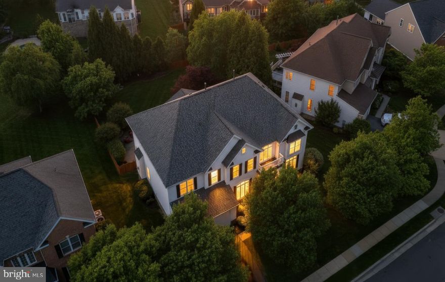 A gorgeous home is ALWAYS worth the wait. Boasting nearly 6,000 square feet, this residence lives large and effortlessly, defined by signature spaces including an impressive foyer, a soaring two story great room, a sun splashed sunroom, an updated chef’s kitchen, and 4 generously sized bedrooms. The finished lower level is another standout, and the private backyard — complete with a patio, stone fireplace, mature trees, irrigation, and a flat fenced yard — delivers the perfect finishing touch.😍
<p>
Before you even step inside, the stately façade, mature trees, and expansive fenced  in backyard with an array of  refreshed features- a composite  deck, custom wrap around paver patio and a stunning outdoor fireplace.  Plus, a multi zone irrigation system keeps the grounds lush and polished, while landscape lighting adds a touch of twilight magic.
<p>
Step inside and the home unfolds with a sense of ease and refinement. The two story foyer-accented by an updated chandelier and a gracefully turned staircase- sets a welcoming tone before opening to the Formal Living Room, where this beautifully proportioned space offers views of the front gardens. Further along, the elegant Dining Room offers serene tree views and a well appointed Butler’s Pantry- with sink- connects to the heart of the home, your Chefs Kitchen😍 Here, beautiful neutral cabinetry shows off the sleek granite countertops and custom backsplash. The vented chef’s hood stands tall against the modern stylish pendants and under and over cabinet lights- taking this kitchen to the next level!  
<p>
Just beyond the kitchen, the sunroom becomes an irresistible gathering place— a light filled retreat wrapped in panoramic views of the lush, private backyard with Mature flowering trees and a Stately row of Evergreens for year round color and privacy.
<p>
From here, the Great Room reveals itself with Dramatic Presence. Towering stacked windows allow endless natural light, while the Floor to Ceiling Stone Fireplace anchors the room with warmth and character. A modern chandelier adds a refined architectural touch and New plush carpeting enhances the room’s inviting comfort. 
<p>
The Upper Level continues the home’s thoughtful design with a series of modern updates that enhance both comfort and style. Enjoy New plush carpeting in all bedrooms and each Bathroom has been refreshed with quartz or granite countertops, updated faucets and lighting, and stylish mirrors that bring a clean, contemporary feel. The Owner’s Suite is beautifully proportioned, offering a serene retreat with a spacious Sitting Room and Two walk in closets featuring Custom Organization. The Luxury Bath feels indulgent, complete with a soaking tub, walk in shower, and private water closet. The secondary bedroom configuration is exceptional. A Prince/Princess suite enjoys its own refreshed ensuite bath, walk in closet, and charming window bench. Bedrooms three and four are generously sized with ample closet space and share a sparkling Jack and Jill bath, thoughtfully updated to match the home’s elevated aesthetic.
<p>
The finished lower level is a true extension of the home’s Livable Luxury. A Restaurant Inspired Bar anchors the space, offering the perfect setting for Entertaining. The expansive Recreation Room accommodates multiple zones — media, gaming, cards, pool — while a separate den provides flexibility for work, guests, or hobbies. A full bathroom, dedicated home gym, and abundant storage round out this level.  A double wide walk up staircase provides easy access to the backyard and patio, making indoor outdoor living seamless.
<
Living in Brambleton offers a lifestyle that’s as vibrant as it is convenient. Walk to: Legacy Park, BramTown Center, Pools, Parks, Tennis, Pickleball and More! HOA covers an impressive list of extras: community package for Verizon FIOS cable and internet, community activities, Trash &  Recycling Service++
<p>
It's time to LOVE where you LIVE😍