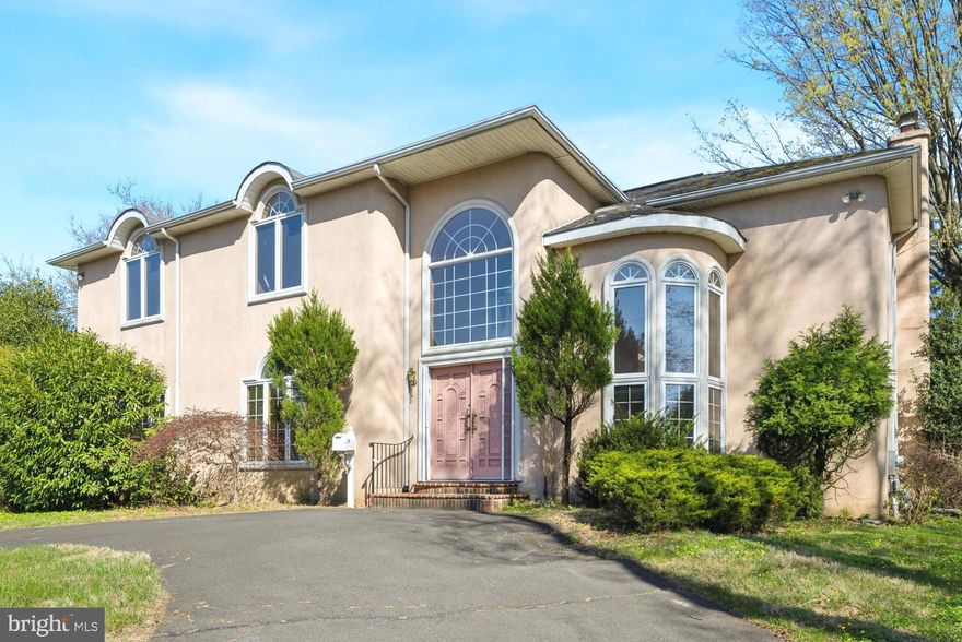 This elegant home is situated in one of Huntingdon Valley's most desirable neighborhoods, within the highly-rated Lower Moreland School District. The first level features a dramatic two-story foyer with double entry doors and a spiral stair tower, a spacious living room with a fireplace, soaring vaulted ceilings, and French doors leading to the rear yard. It also includes a breakfast room with French doors, a spacious kitchen with a center island, a dining room, a generously sized family room, a full bath, a laundry room, and access to an oversized two-car garage. The upper level boasts a luxurious primary bedroom that features cathedral ceilings, French doors leading to a private sun porch, a huge walk-in closet, and a  spacious ensuite bathroom complete with double sink vanity, a relaxing soaking tub, and a stall shower. This level also offers two additional bedrooms and a hall bath. The Lower Level is an unfinished basement. This luxurious, custom-built home offers a sense of spaciousness, enhanced by vaulted ceilings, an abundance of windows, Palladian windows, French doors, and numerous architectural features that maximize visual space and natural light. This home enjoys an ideal location with easy access to both Philadelphia and Bucks County, and it's within walking distance of the West Trenton Line at the Bethayres Train Station. It is also conveniently located near major roadways such as US Route 1, Route 73, I-95, Route 611, and the Pennsylvania and New Jersey Turnpikes. Although this home requires some updating, it offers a unique opportunity for a buyer with a vision for modernization and enhancement of its inherent features. With thoughtful updates, this property has the potential to truly shine and offer substantial long-term value.