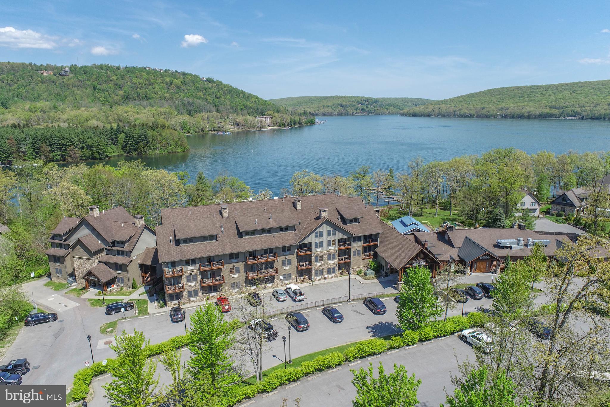 Wake up to the lake at your doorstep. This ground-level, end-unit condo puts you right where you want to be—direct lakefront with unbeatable access to everything Deep Creek offers. Walk out to the water, hit the gym, unwind in the sauna, or challenge friends in the game room. Dutch’s at Silver Tree, The Harbor Bar, and Silvertree Marina are all within reach, making lakeside dining and boat days effortless. When adventure calls, Wisp Resort and state parks are just minutes away. No hassle—just pure lake life, right where it should be. Call today for your private showing!