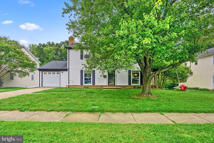 Backing to trees and situated on a .23 acre homesite in popular Bedford sets the stage for this 1,888 sq ft colonial presenting a neutral color palette, a bright living room with gleaming hardwoods, and an open
dining room with ceramic tile flooring. Ceramic tile flooring introduces the kitchen boasting sleek granite
counters, complementing tile backsplash, trending Shaker style cabinetry, an apron sink with a gooseneck faucet, stainless and white appliances including a newer refrigerator, including a canopy range hood, a peninsula island with a breakfast bar, and a breakfast room with a walkout to the deck.  Enjoy entertaining and casual play in the family room highlighted by rich hardwoods and a brick fireplace with a crisp white mantel. This highly convenient location offers easy access commuter routes to Baltimore and Washington, the ICC, shopping, dining, recreation, and more!
