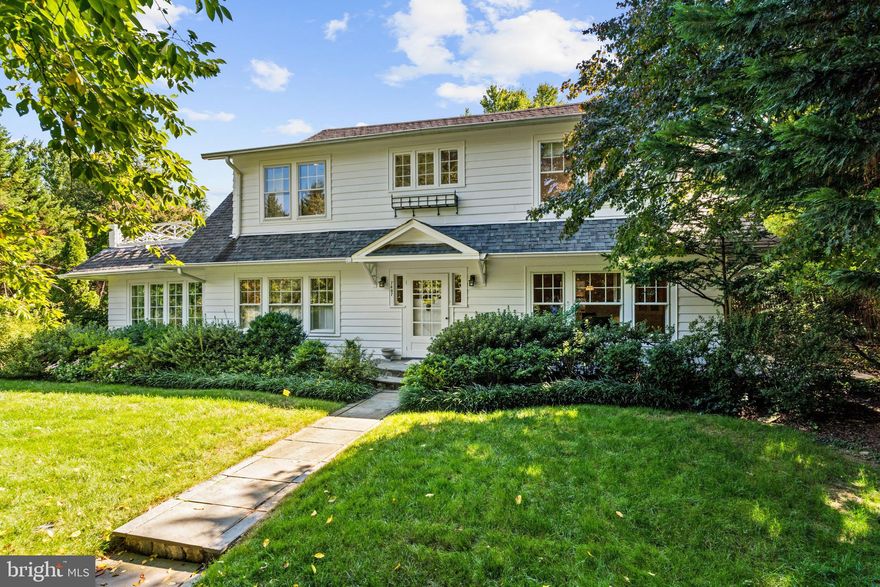 This beautiful single-family residence is desirably located on a nearly quarter-acre lot in the sought-after town of Chevy Chase. The house was originally built in 1928 and many of the original details have been superbly maintained. The house is exceptionally private, sited behind beautifully layered front landscaping and mature trees. The interior of the house has lovely hardwood floors and is filled with an abundance of natural sunlight from large windows throughout. The welcoming entry foyer has a coat closet and provides seamless transition to the formal entertaining rooms. The impressive double living room has a large central wood-burning fireplace and features two glass paneled doors to the exterior rear terrace. Two sets of interior French doors lead to the gracious library, which has a wall of bookshelves, cabinetry storage, and beautiful light exposures on three sides. The formal dining room has a built-in serving buffet and china cabinets. It is conveniently located adjacent to the kitchen, which is accessed via a swinging door. The gourmet eat-in kitchen has abundant cabinetry, black granite countertops, a Viking six-burner range and ovens, and a pantry. It opens to the sunny breakfast area, which directly accesses the rear terrace. There is also the added convenience of a powder room on this floor. The upper level has four bedrooms and two full bathrooms, including the luxurious primary suite. The light-filled primary bedroom is well-appointed with a charming dressing nook that is lined with closets. There is also a spa-inspired en-suite bathroom with marble dual vanities and a frameless glass shower. The three additional bedrooms on this floor capture wonderful sunlight and access the hall bathroom. The lower level is perfect for entertaining and offers a spacious family room, an expansive game room with a built-in desk, a large laundry room with a secondary refrigerator and utility sink, a full bathroom, and multiple storage and mechanical rooms. The exterior grounds of the residence are immensely private, with a large flat front yard, a lovely rear terrace for entertaining, and a shared driveway leading to a detached one-car garage.