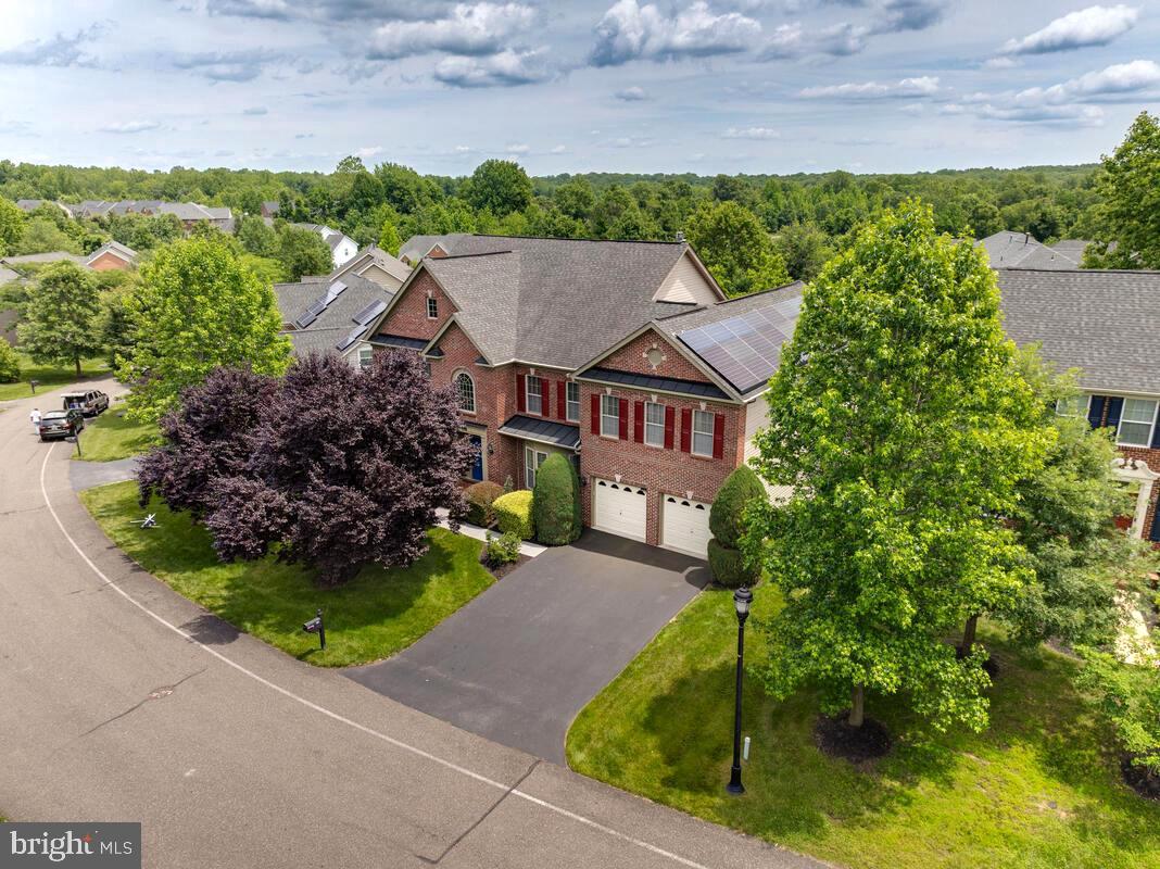 Enjoy classic elegance in Prince George's premier gated community of unique, custom homes and estates. 412 Stanwish is a beautiful and spacious home and a veritable feast for the eyes. Luxury begins with the beautiful brick façade, lush, mature landscaping and thoughtfully designed hardscape for a gracious outdoor living; this home delivers from the curb... Then you enter into the sunlit two-story foyer drawing your eyes upward to the elegantly curved staircase (one of two!) and on to the beautiful hardwood floors leading to a custom designed office/study with bookcases and ample storage. The living spaces begin with a spacious living room and a massive formal dining room with possible seating for 12, both crowned by elegant moldings. Pause for a minute to enjoy these lovely light infused rooms as you make your way into the piece de resistance: a gloriously open great room, the entertainment spaces of your dreams: a well-appointed gourmet kitchen with all that modern hosting and chefs demand: banks of elegant 42" cherry cabinets, a large walk-in pantry, a massive curved island with bar seating for six plus, a cozy breakfast area, top of the line stainless steel appliances featuring double ovens, microwave, cooktop and downdraft and gleaming wood floors! The magic continues into the sun/morning with more beautiful wood floors, windows that bring the outdoors in and great views to the back yard and large deck. The humungous Gathering Room is appointed with custom transom windows everywhere and provides an opportunity to appreciate the size and scale of this beautiful home... Yet, it is warm, inviting and anchored by a beautiful fireplace and a mantle especially made for Christmas stockings!
Ascending the stairs to the second level affords the opportunity to enjoy the streaming light of the palladium window as well as generous hallways that connect the bedrooms on this level as well as the upper second level bedroom and play/ hobby room. Of note, each bedroom has its own bath for a total of four large bedrooms and four baths plus an additional bedroom and bath on level two for a total of five bedrooms and five baths. Entering into the Owners Suite is the gateway to your own private getaway for gracious and luxurious living: a spacious sitting room leads to the owners’ room with dramatic, soaring cathedral ceilings, dual sided fireplace, two walk-in closets, dressing area and an elegant ensuite bath anchored by a large jetted tub, separate shower and his and hers vanities. The basement is as enormous space that walks out to the extensive brick patio. It also hosts the sixth bedroom and attached bath, as well as a separate exercise room. This large space can also accommodate cozy gathering areas, PLUS recreation and hobby actives. It is also great place to entertain friends as you watch your favorite sporting event or concert on your 85" TV! More: plumbing is already in place to create that coveted bar or second kitchen! All of this and a smaller carbon footprint too, courtesy of the TRANSFERABLE SOLAR SYSTEM. OTHER SPECS: New high efficiency HVAC system 2024, new basement flooring 2025, in-ground sprinkler system and Gutter Guards.
OAK CREEK is an amenity rich community with a clubhouse and restaurant plus activities for every age, including golf (membership required), tennis, and swimming in an Olympic sized pool and access to public walking and biking trails!
The world is within reach: THIS HOME OFFERS A GREAT LOCATION FROM WHICH TO NAVIGATE THE DMV: ONLY A SHORT DISTANCE TO MAJOR TRANSPORTATION ROUTES: 50, 295, 495 & I-95, MERE MINUTES TO DOWNTOWN WASHINGTON, DC, TO ANNAPOLIS, NORTHERN VA AND MUCH OF THE GREATER METRO AREA. GREAT ACCESS TO PARKS, SHOPS, SHOPPING, FINE DINING, WATERFRONT ACTIVITIES, ENTERTAINMENT, MARINAS, SPORTS ARENAS AND AIRPORTS ARE MINUTES TO A SHORT DRIVING DISTANCE AWAY. So, much ado about a beautiful home in a great location!