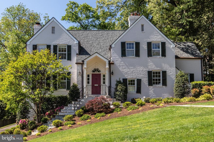 Majestically sited on a hillside with a wonderful Potomac River view, this immensely charming 1940 brick residence awaits the most discriminating Purchaser!  Located in sought-after Belle Haven, this very special home features detailed moldings, three bay windows, sparkling hardwood floors and three fireplaces.
Perfect for gracious entertaining and comfortable family living, this lovely home offers exceptional charm and character.  The elegant living room features a gorgeous marble fireplace, loads of windows, fluted columns, and a wet bar with glass shelves, and cabinetry below.  
The formal dining  room offers a bay window and two lovely archways.  The comfortable den boasts a spectacular water view, gas fireplace, plus custom bookshelves and cabinetry.  The recently updated kitchen includes stainless steel appliances, center island, marble counters and two sets of French doors opening onto flagstone patio.  A cozy home office with desk and built-in bookshelves completes the main level.
The upper level features a primary bedroom with fabulous water view, woodburning fireplace and updated bathroom with skylight.  Three additional bedrooms plus two more updated baths complete the upper level.  The lower level includes a spacious room with bay window with brand new carpeting perfect for home office, family room or play room.  Abundant storage plus two garages complete the lower level.  
Perfect for outdoor entertaining on the two flagstone patios overlooking lovely mature plantings including azaleas, Rhododendrons, laurel, holly plus towering trees.  Fireplaces in dinning room and lower level office convey in as-is condition.  
Don’t miss this very special Belle Haven gem!