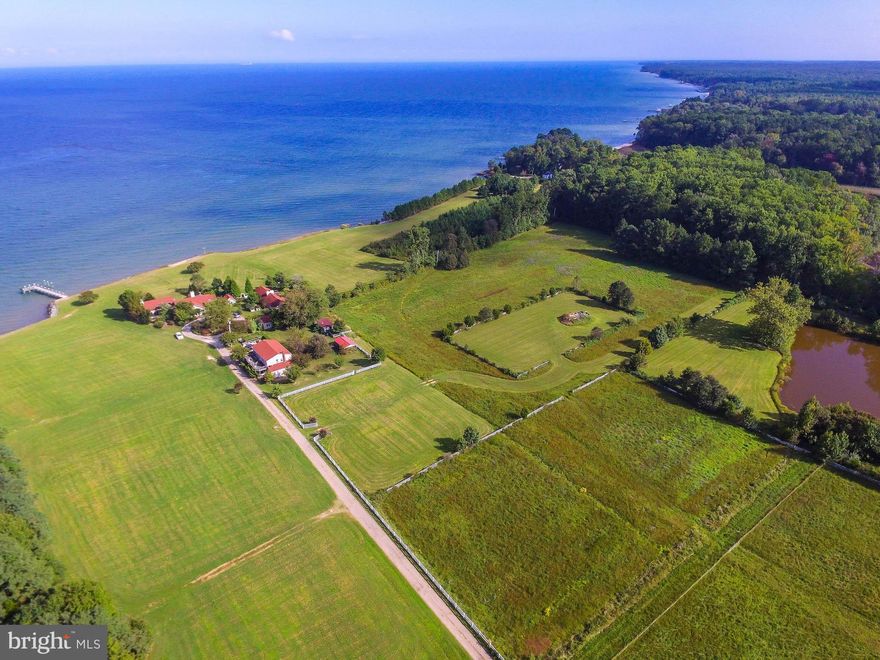 Looking for a stunning Chesapeake Bay farm compound w/main house/guest house/caretaker's apartment/lodge house + studio? Wide open view of the Bay, lots of private sandy beach (appr. 2300 ft), rip rap, pier. 108 acres, beautiful lawn, lush mature landscaping/fruit trees. This property has many possibilities w/multiple living spaces, privacy and great beauty.  See Farm Remarks for more detail.