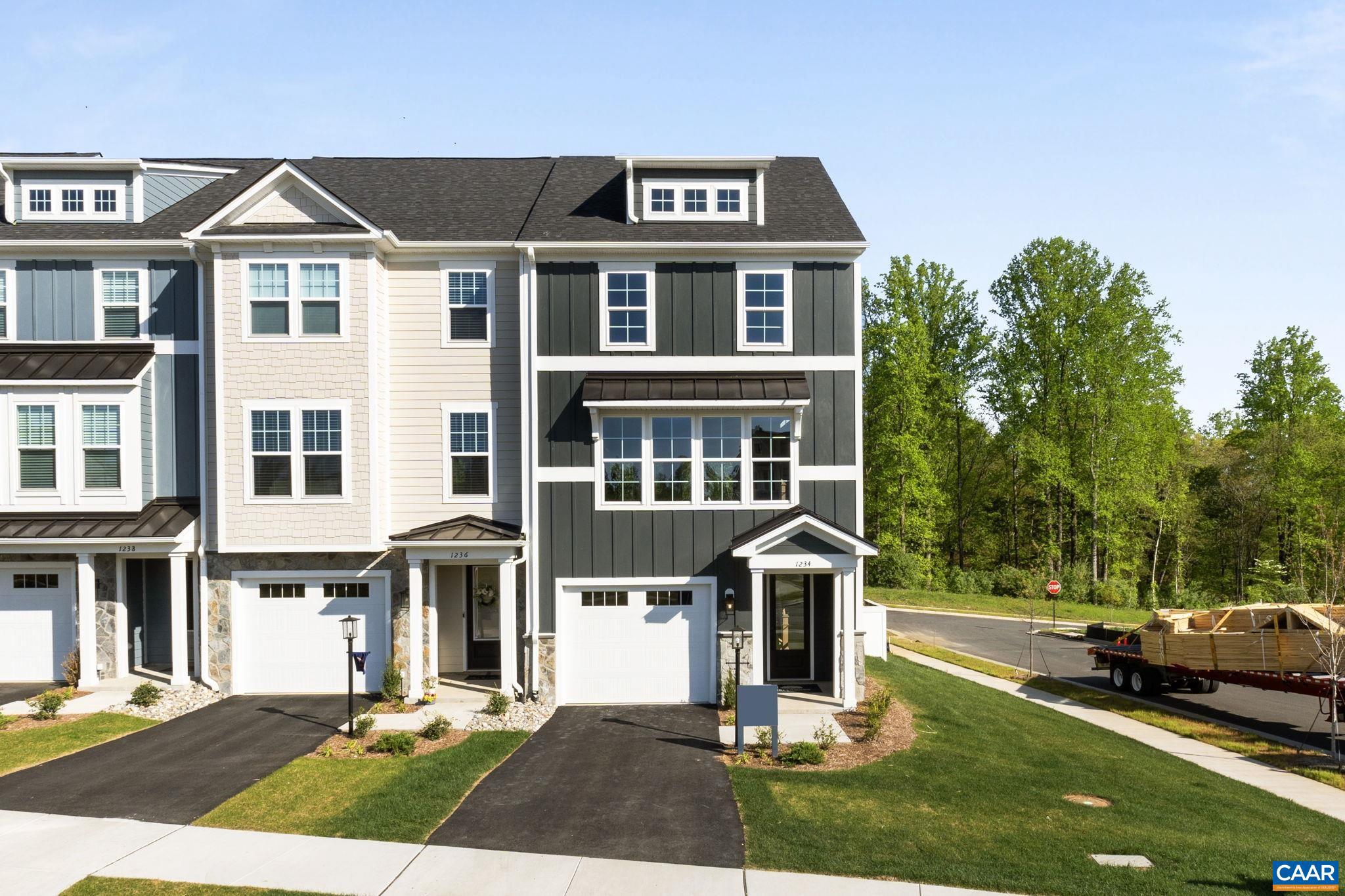 Discover the Holly I, a beautifully designed three-story end unit townhome in the newest section of Belvedere, set for an early Fall '25 completion! This spacious home features a flexible layout, starting with a rec room and half bath on the first floor, perfect for a home office, gym, or additional living space. The second floor?s open-concept design includes a large kitchen with a walk-in pantry, a generous dining area, and a sunlit family room, plus an included screened-in porch for outdoor enjoyment and an additional half bath. Upstairs, the primary suite offers a luxurious en suite bath, while two additional bedrooms share a well-appointed hall bath. The laundry is conveniently located on the third floor, and thoughtful upgrades like oak stairs with open railings add style and functionality. A front-facing one-car garage provides parking and storage. Belvedere offers an array of amenities, including access to parks, close proximity to the Rivanna trailhead, the nearby SOCA Fieldhouse, a dedicated dog park for pet owners, and enchanting playground areas. Photos are of similar model home and may show optional upgrades.,Granite Counter,Maple Cabinets,Painted Cabinets,White Cabinets,Wood Cabinets