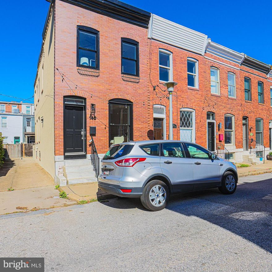Beautiful Park Living | Half-Block to Patterson Park | End of Row | 3 Finished Levels | Solar Powered

The one buyers wait for. Fully renovated, impeccably maintained, and truly move-in ready, this exceptional Patterson Park rowhome pairs timeless character with high-impact upgrades—just ½ block from the park in its quiet northeast annex. Offering 3 fully finished levels, 2 full baths and 2 half baths, Brazilian cherry floors, and fresh professional paint throughout, this home exceeds the needs of modern city living.  The rooftop’s solar array saves you significant money on your monthly electric bill - great for the planet and your wallet.

Main Level – End of Row (more space and windows) Elevated Design 
This is not a cookie-cutter renovation. Original architectural molding and details blend seamlessly with a modern, open layout with coffered ceilings, designed for both entertaining and everyday comfort. The well-lit living room features 3-sided gas fireplace, and exposed brick. 

Spacious dining room, layout is perfect for entertaining. The modern kitchen includes granite countertops, stainless steel appliances, abundant cabinetry, and a great island with seating. Includes a convenient main-level powder room. Defined yet open spaces create effortless flow—perfect for intimate dinners, game nights, or relaxed evenings at home. 

Upper Level – Two Bedrooms | Two Full Baths  
Upstairs offers the layout buyers are seeking: two spacious bedrooms, two full ensuite baths, and spacious closets. The primary suite impresses with a dramatic 10’ ceiling, ceiling fan, and ensuite bath with jetted tub/shower. The second bedroom—ideal for guests, roommates, or a home office— and also features an ensuite bath with jetted tub/shower, with direct access to the rear deck/balcony. Morning coffee. Evening wine. Fresh air just steps from your bedroom. 

Fully Finished Lower Level – Full Ceiling Height 
The versatile lower level offers a space for an office/desk and a generous room - perfect for a family room, media lounge, fitness studio, office, or creative space. Flexible finished square footage adds meaningful value and livability. 

Location That Drives Demand 
Half-block to Patterson Park’s dog park, tennis courts, pool, ice rink, and athletic fields. Charming Tivoli lights run the entire street block above both sidewalks, creating a cozy & safe evening environment at everyone’s marble stoop-front. Generous overflow parking on Pratt & Linwood. Minutes to Canton, Fells Point, and Brewer’s Hill shopping & dining. Quick access to I-95, I-895 & I-83 for seamless commuting. Close to Johns Hopkins Bayview & medical campuses Homes this close to the park— outdoor space, and authentic historic charm and an end unit—are rare get it before it is gone! 

Schedule your private tour today. Exceptional location. Distinctive character. Turnkey condition. 
First American Eagle Premier Home Warranty!