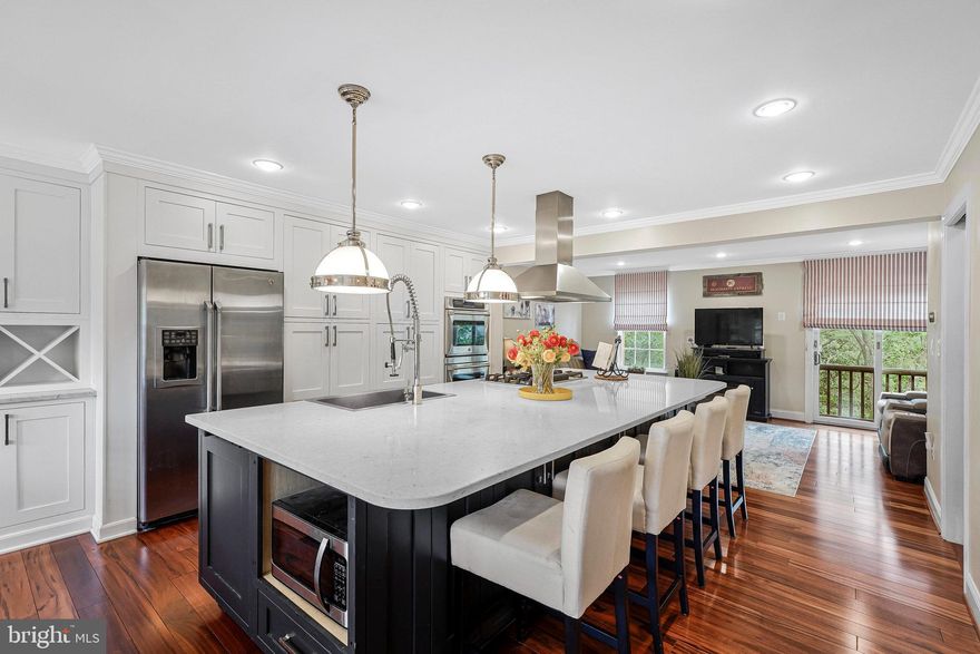 **Catered Open House this Friday (10/10) 4:30-6:30pm,  Saturday (10/11) 12-2pm and Ice Cream Truck Sunday Open House (10/12) 12-2pm**

Welcome to Kincaid Forest—a neighborhood people love because life here just feels easy. This 4-bed, 3.5-bath townhome has the updates you actually want, so you can move right in and start enjoying it.

Step inside and the Tigerwood floors pull you straight through the open main level. The kitchen is where everyone will end up—around the big island under those pendants—while dinner bubbles on the gas cooktop and the chimney hood quietly does its thing. GE Café appliances, double ovens, soft-close wood cabinets with pull-outs, marble counters, glass-front uppers, and built-in wine storage… it’s all here and it all works. And the best part for real life: the cabinetry extends into the dining room, creating a beautiful built-in buffet with even more storage for dishes, small appliances, and all the “where do we put this?” stuff.

Upstairs, the primary suite is your exhale—roomy and calm with a walk-in closet and a beautifully updated bath in classic black and white. Two more bedrooms and another updated full bath give everyone their own corner.

The walk-out lower level is where this home really stretches out. Travertine tile underfoot, a flexible rec room for movie nights or a home gym, a true fourth bedroom with an updated full bath, and a beautifully remodeled laundry room you’ll actually like using—built-in sink and tons of cabinetry—all tucked neatly in the basement.

Slide the door open and you’ve got a private, fenced backyard—easy to maintain and perfect for grilling, letting the dog out, or sipping coffee while the sun comes up.

And the location is the cherry on top. In Kincaid Forest, you’ll actually use the amenities: stroll to the pool on hot days, meet neighbors at the tennis or pickleball courts, or hop on the W&OD Trail for a bike ride or evening walk. You’re minutes to Wegmans, Village at Leesburg, coffee shops, parks, medical centers, and everything in downtown Leesburg.

Peace of mind, too: all baths updated, 2017 roof, and a 2017 water heater.

This isn’t just a house—it’s a home that makes everyday life simpler and weekends more fun.